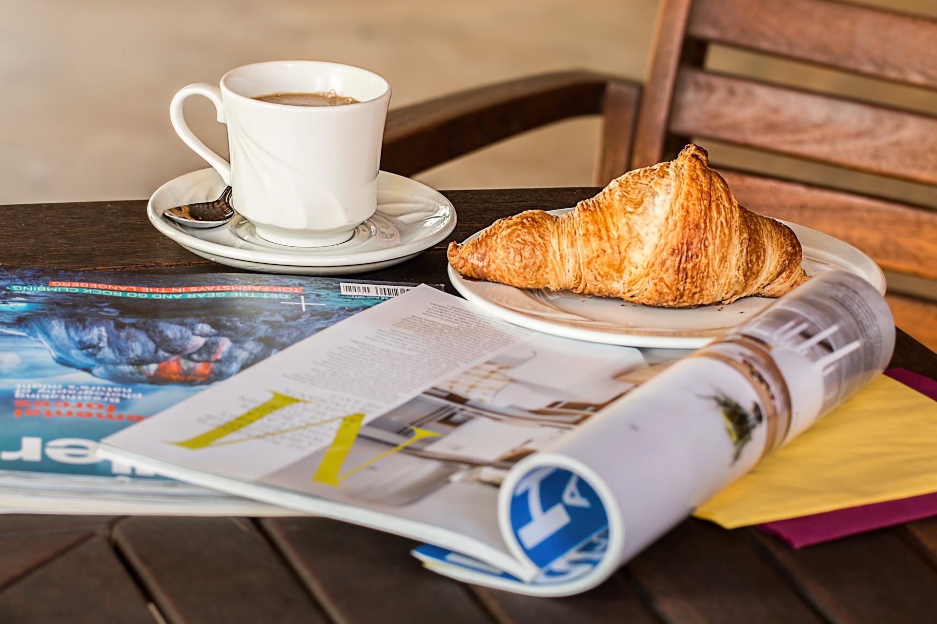 Magazines and food on a table | Source: Pexels