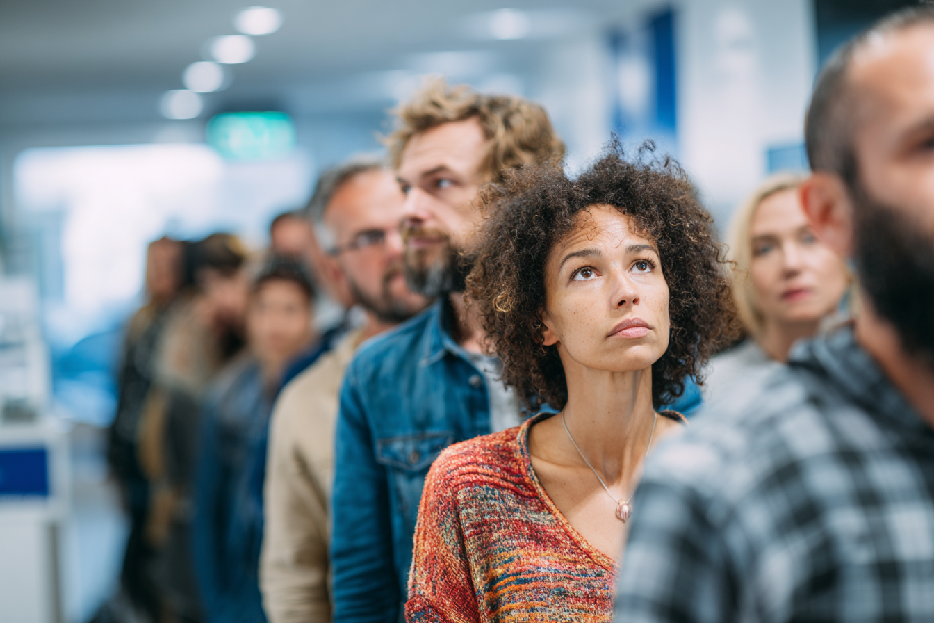 People standing in a queue | Source: Midjourney