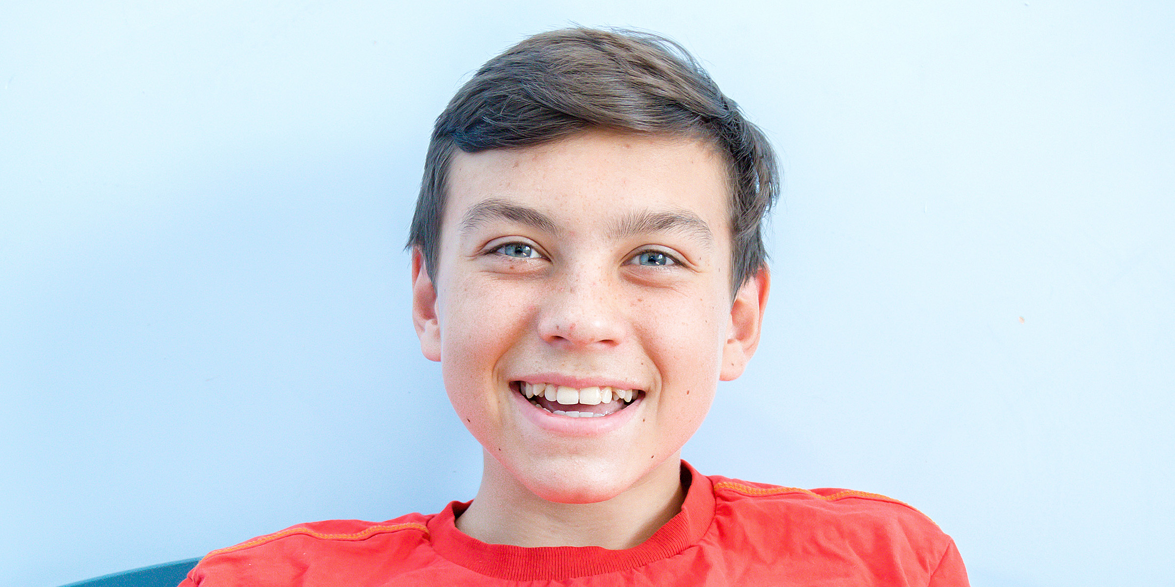 A boy laughing | Source: Shutterstock