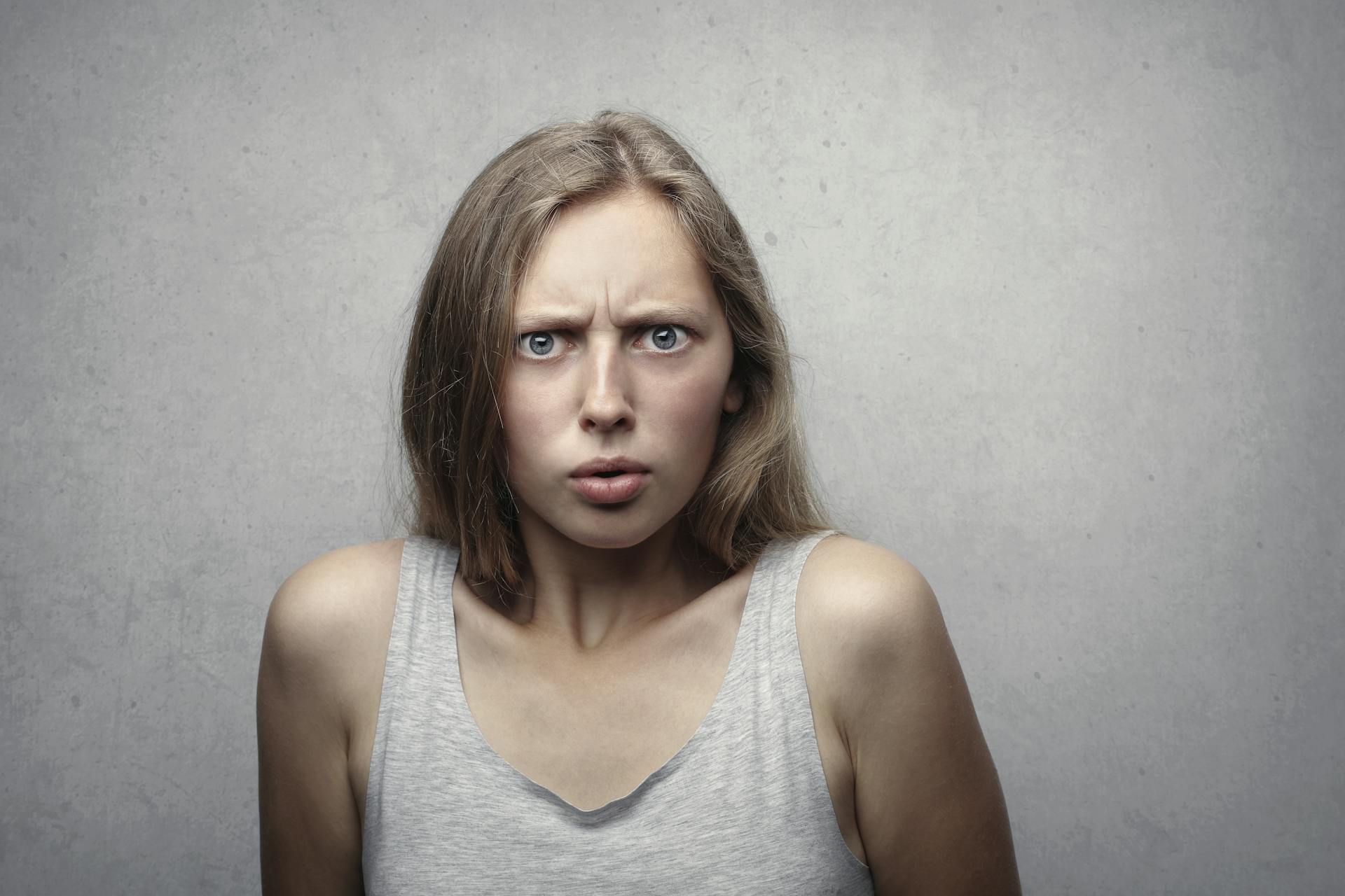 A woman with a confused frown staring at someone | Source: Pexels
