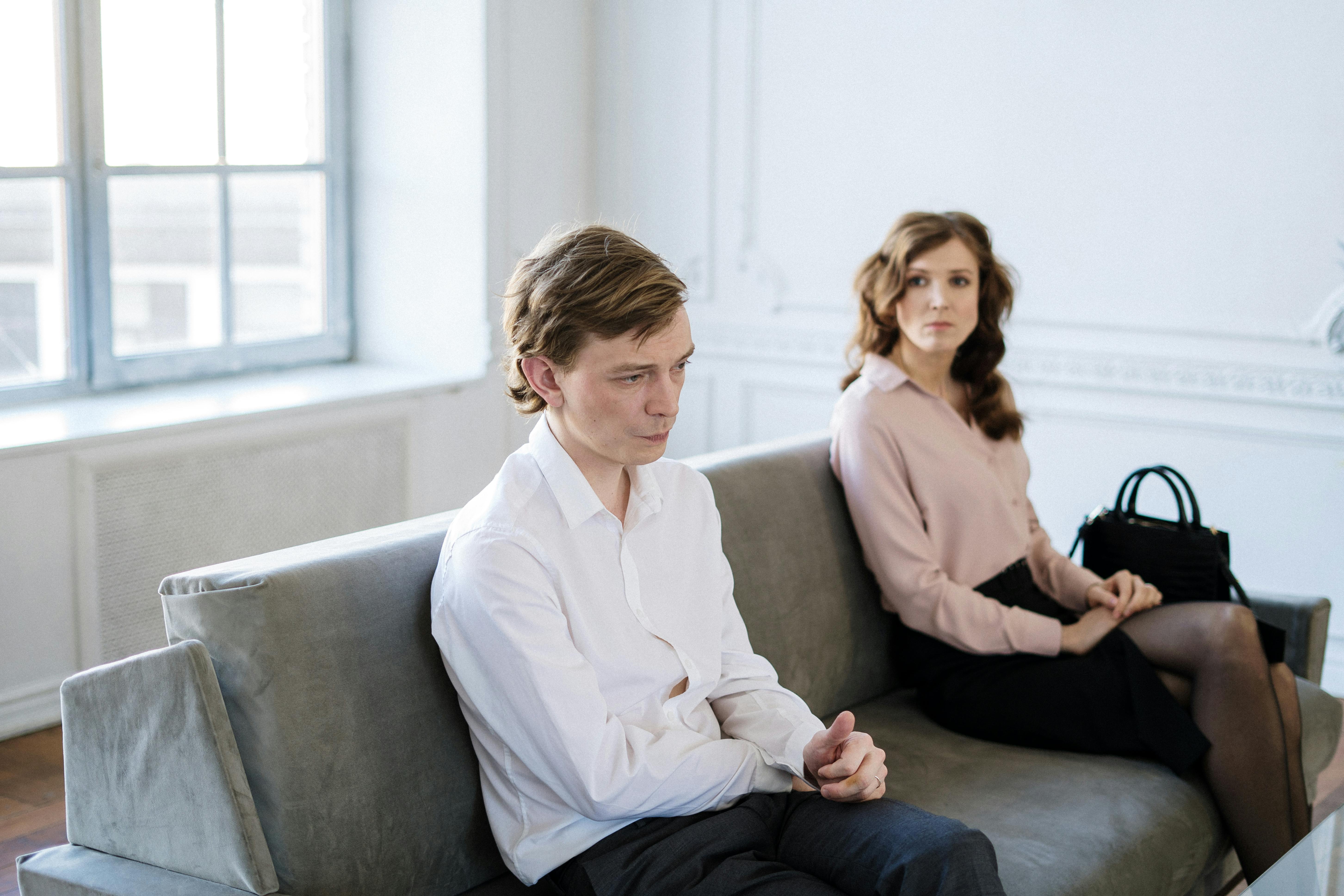 A sad couple seated together | Source: Pexels