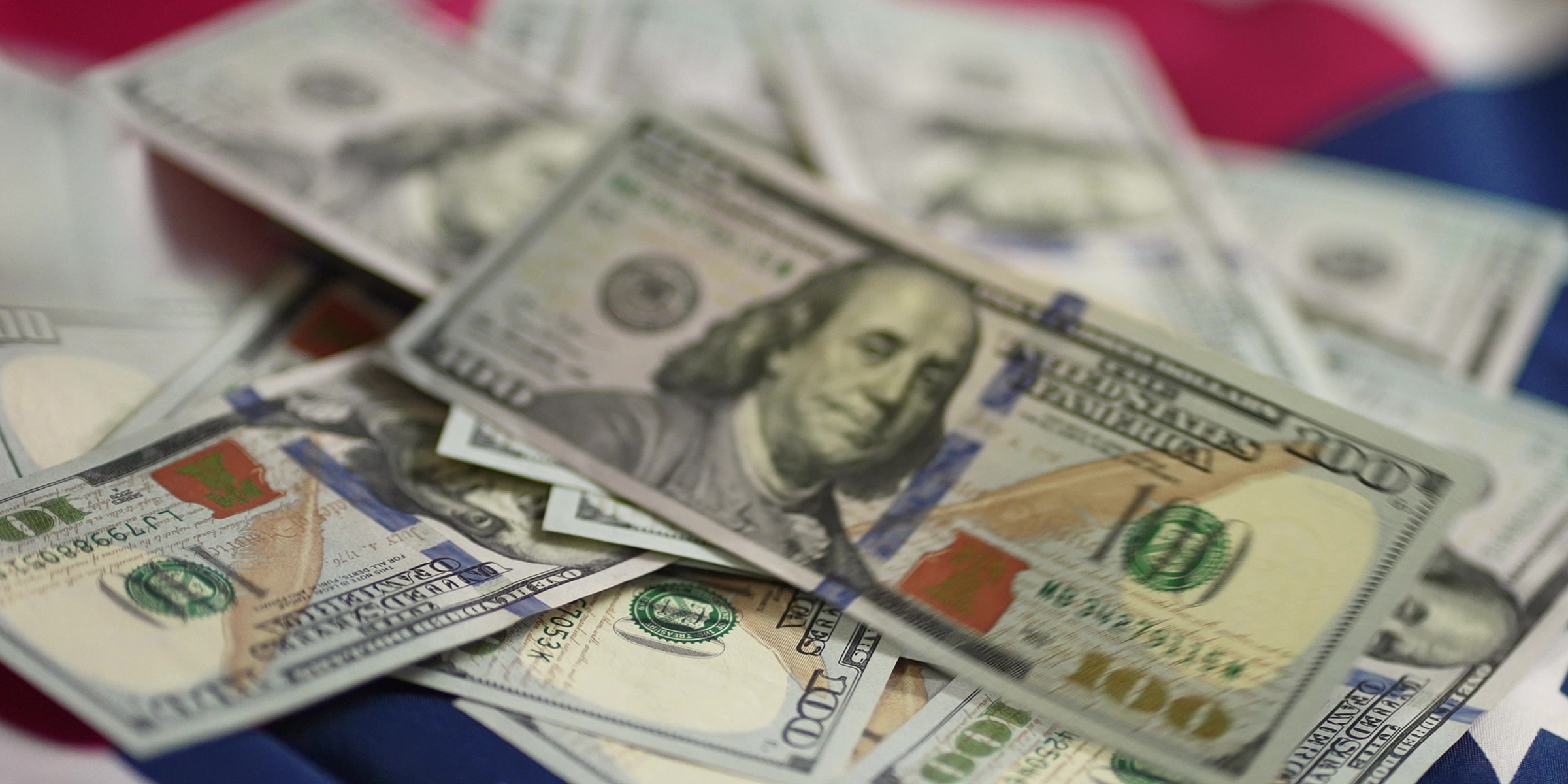 Dollar notes on a table | Source: Shutterstock