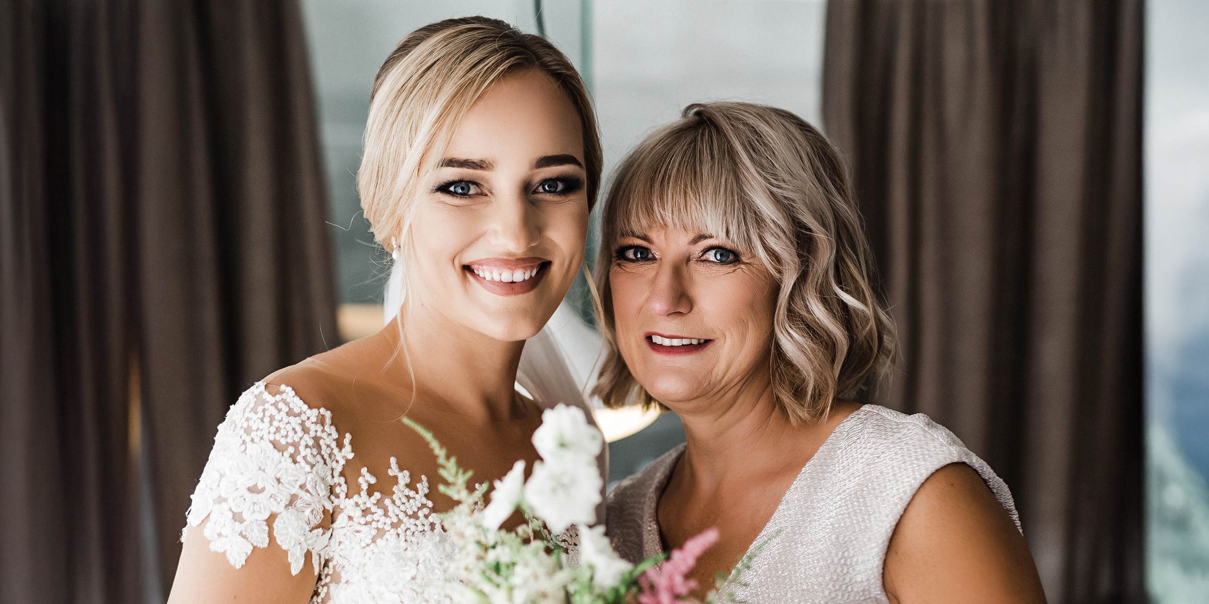 A smiling bride with her mother | Source: Shutterstock