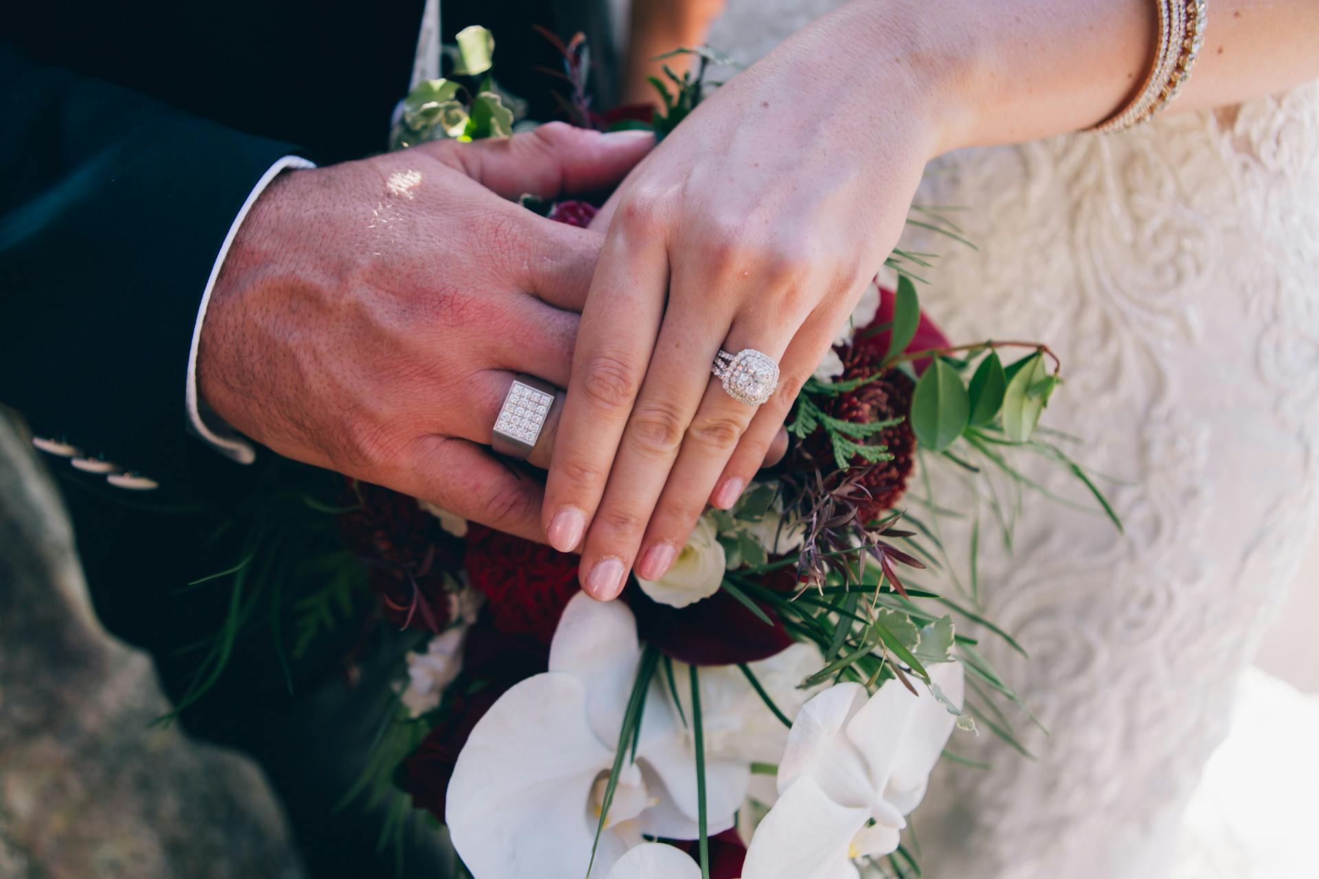 A couple showing their rings on their wedding day | Source: Pexels