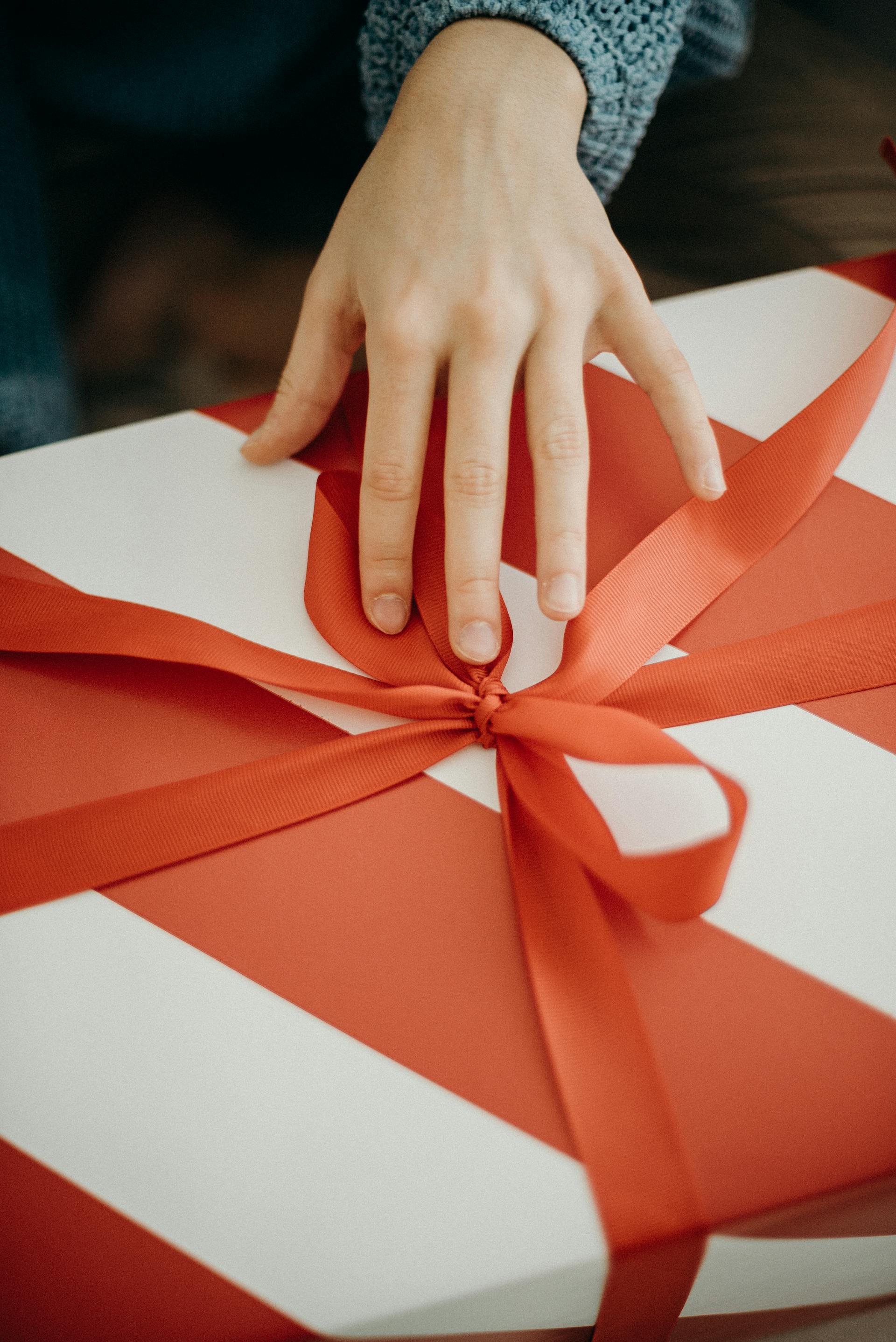 A woman touching a gift box | Source: Pexels