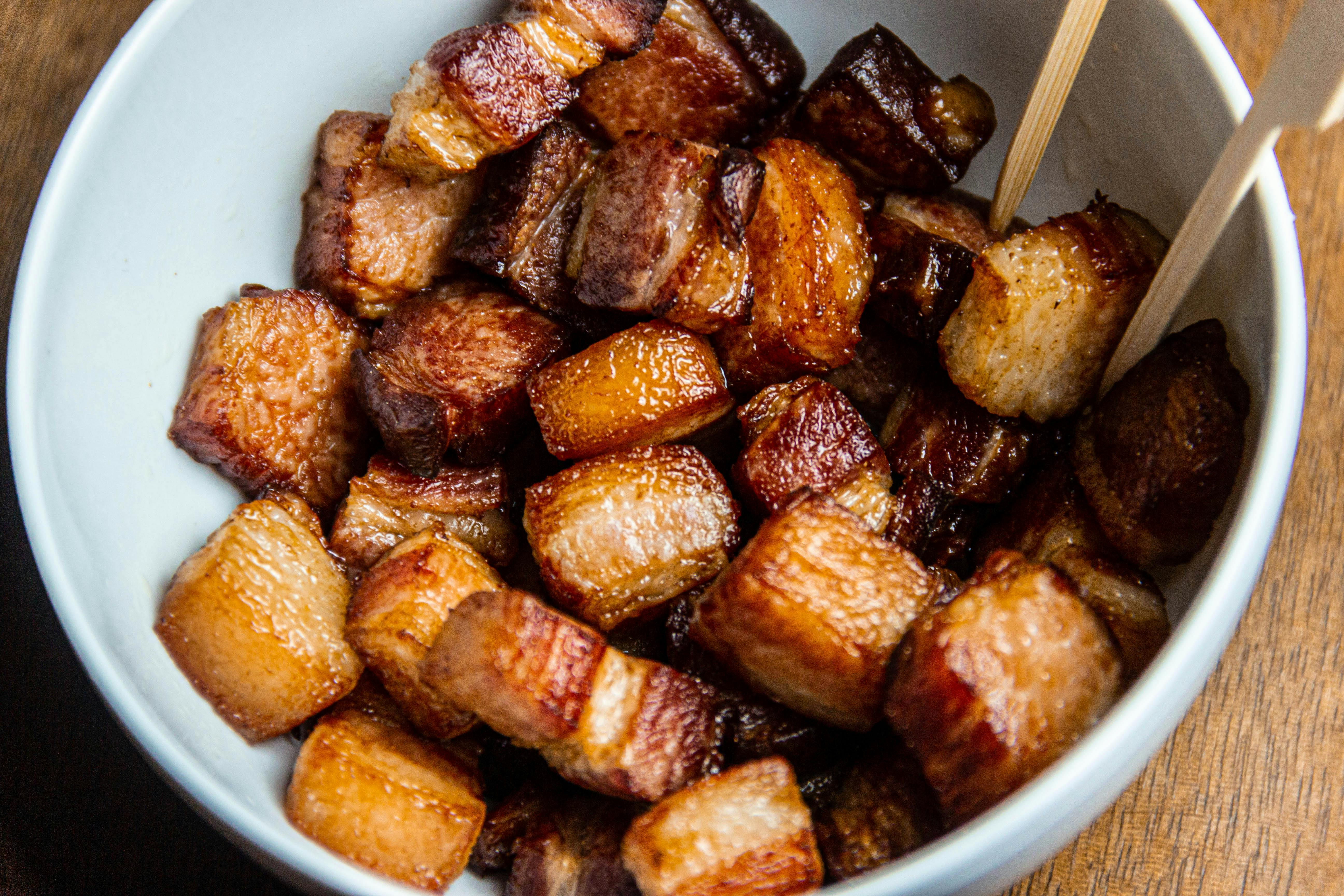 Caramelized pork belly in a pan | Source: Pexels