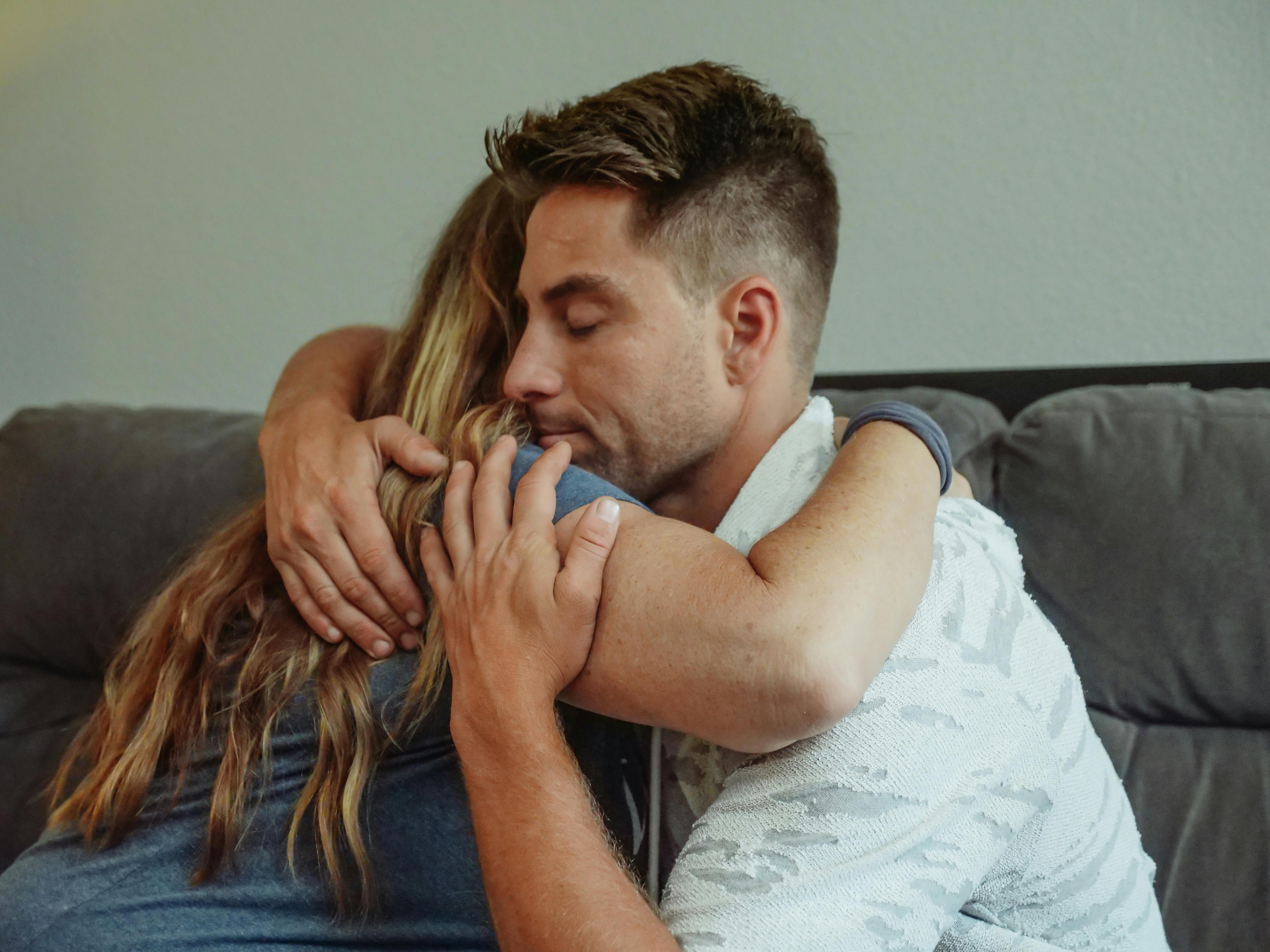 A man hugging a woman | Source: Pexels