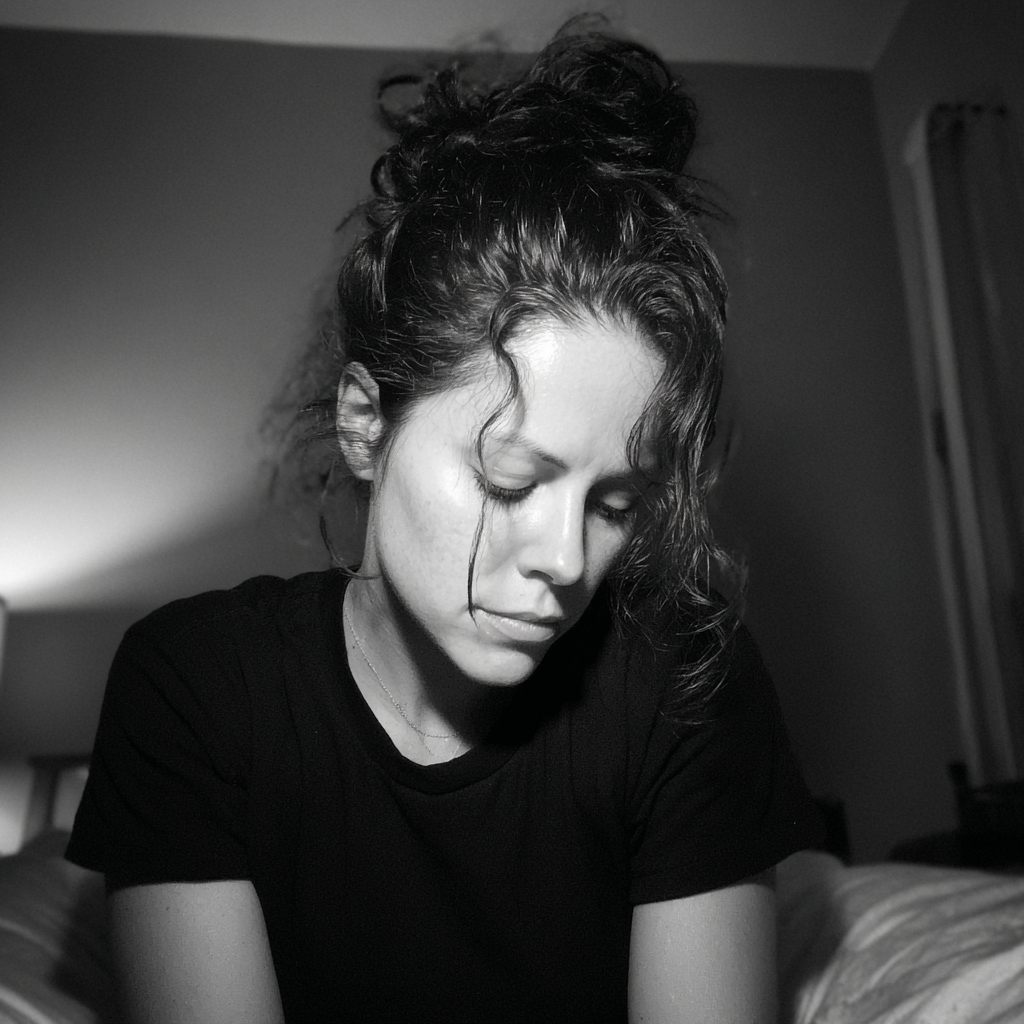 A woman wearing a black t-shirt | Source: Midjourney