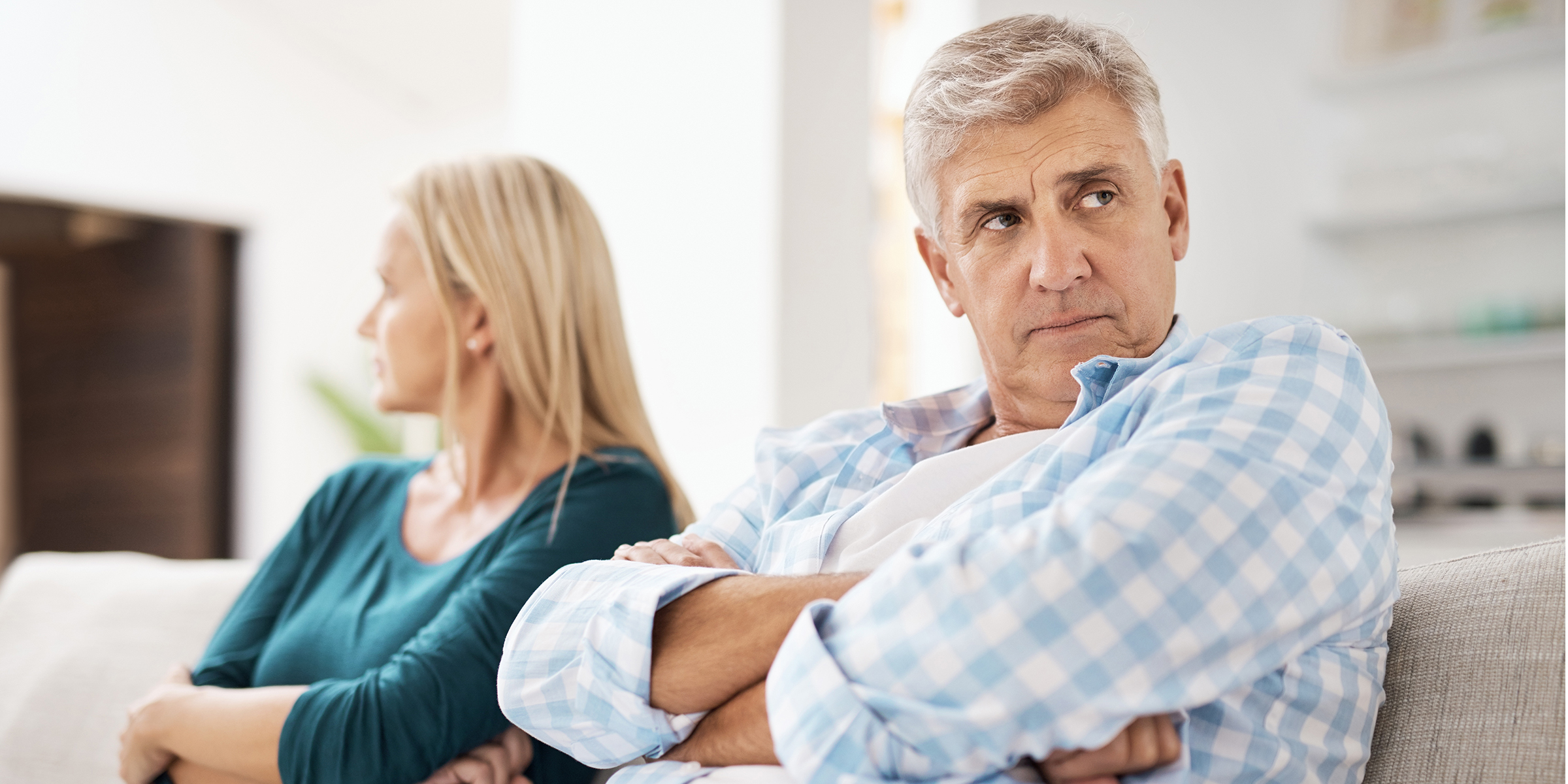 A couple with their arms folded | Source: Shutterstock