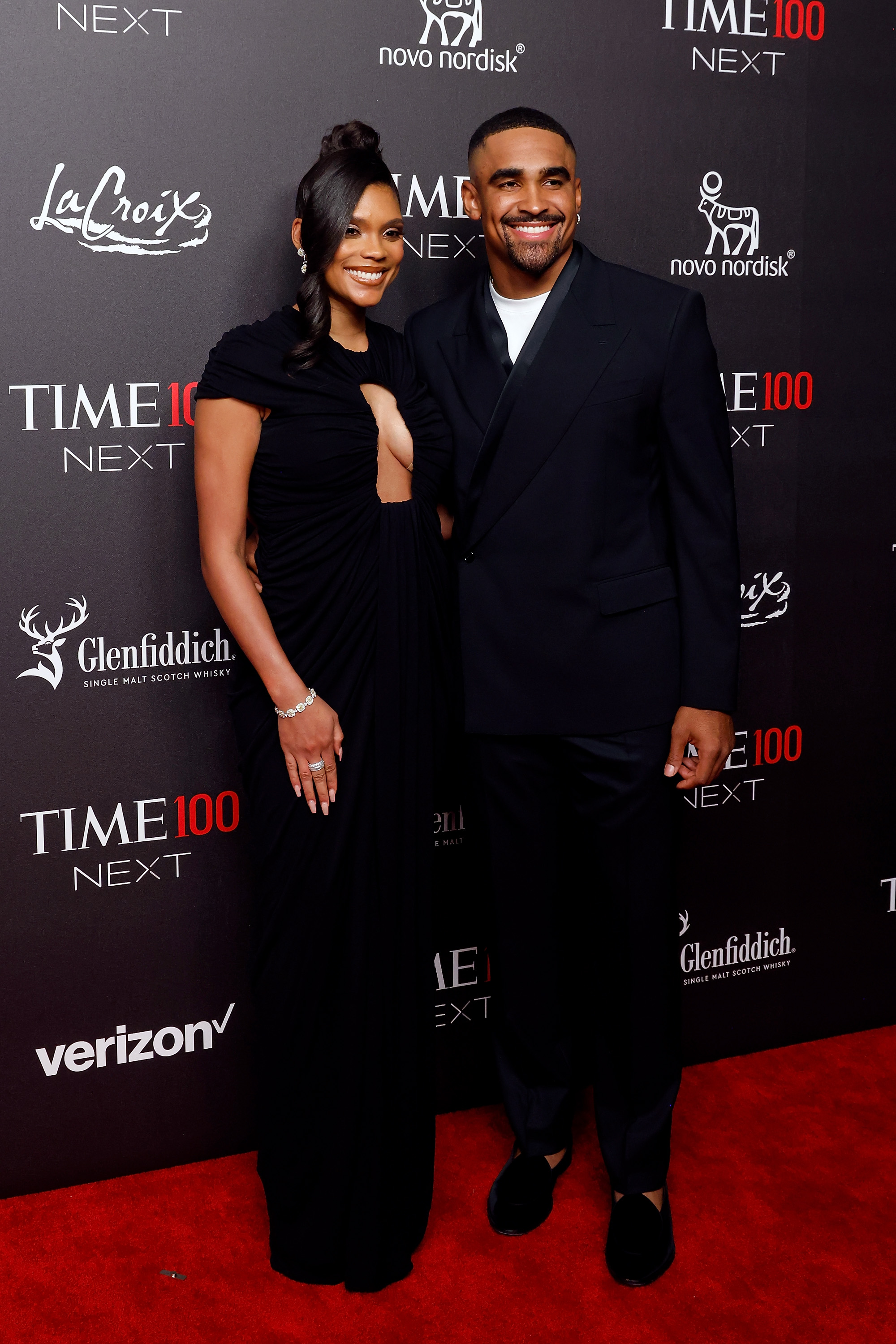 Bryonna Burrows and Jalen Hurts posing on the red carpet. | Source: Getty Images