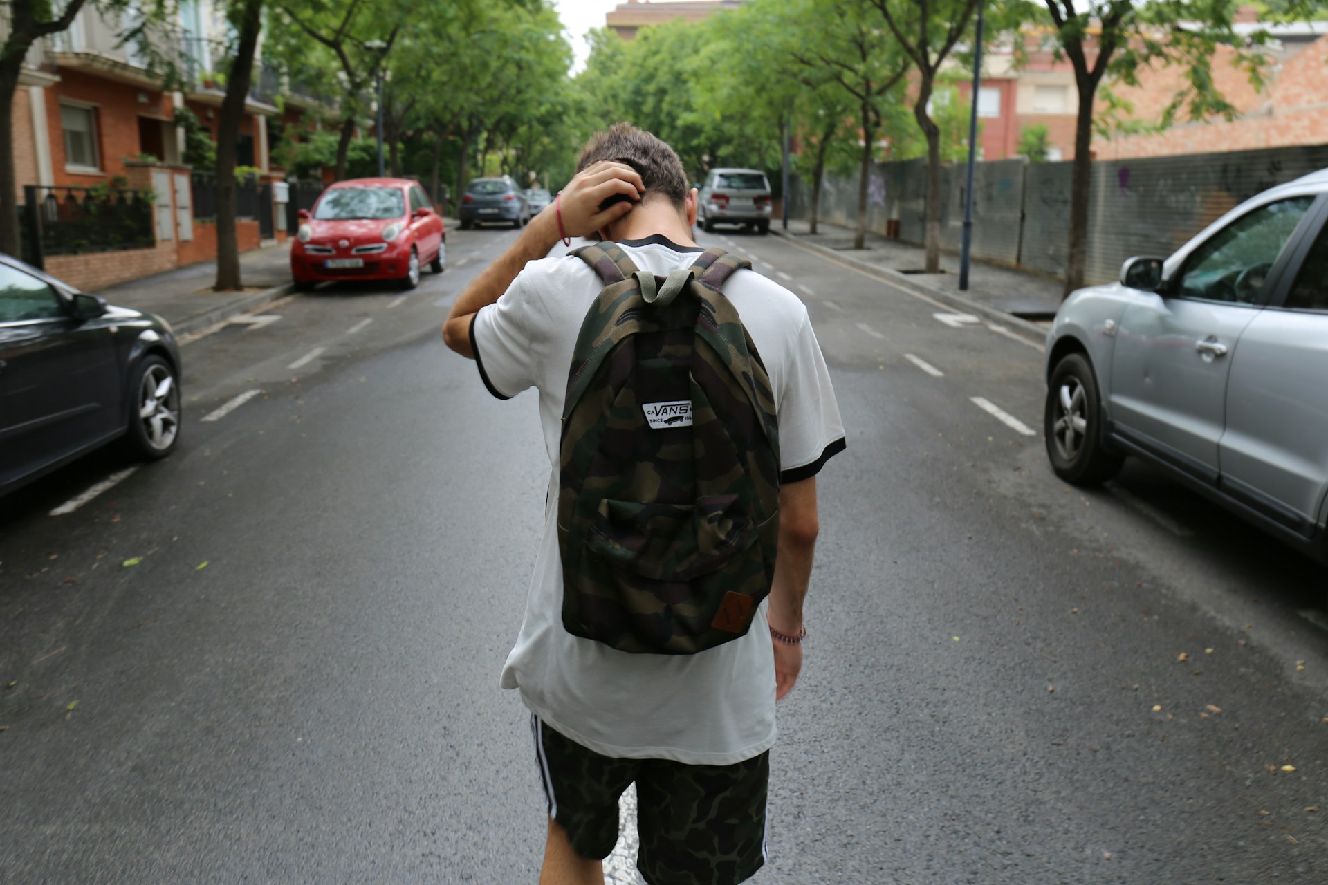 A young man walking on the street | Source: Unsplash