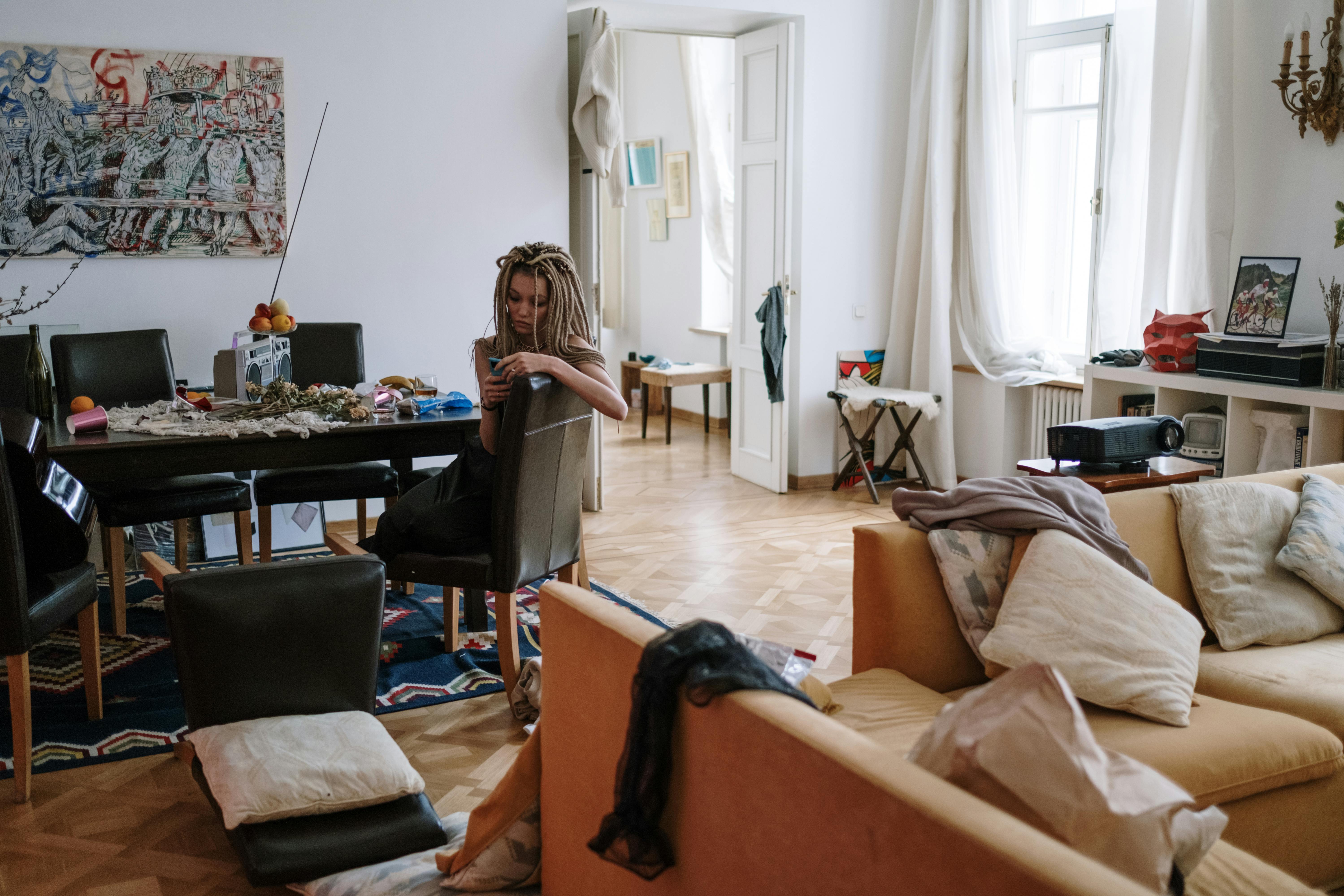 A woman in a messy home | Source: Pexels