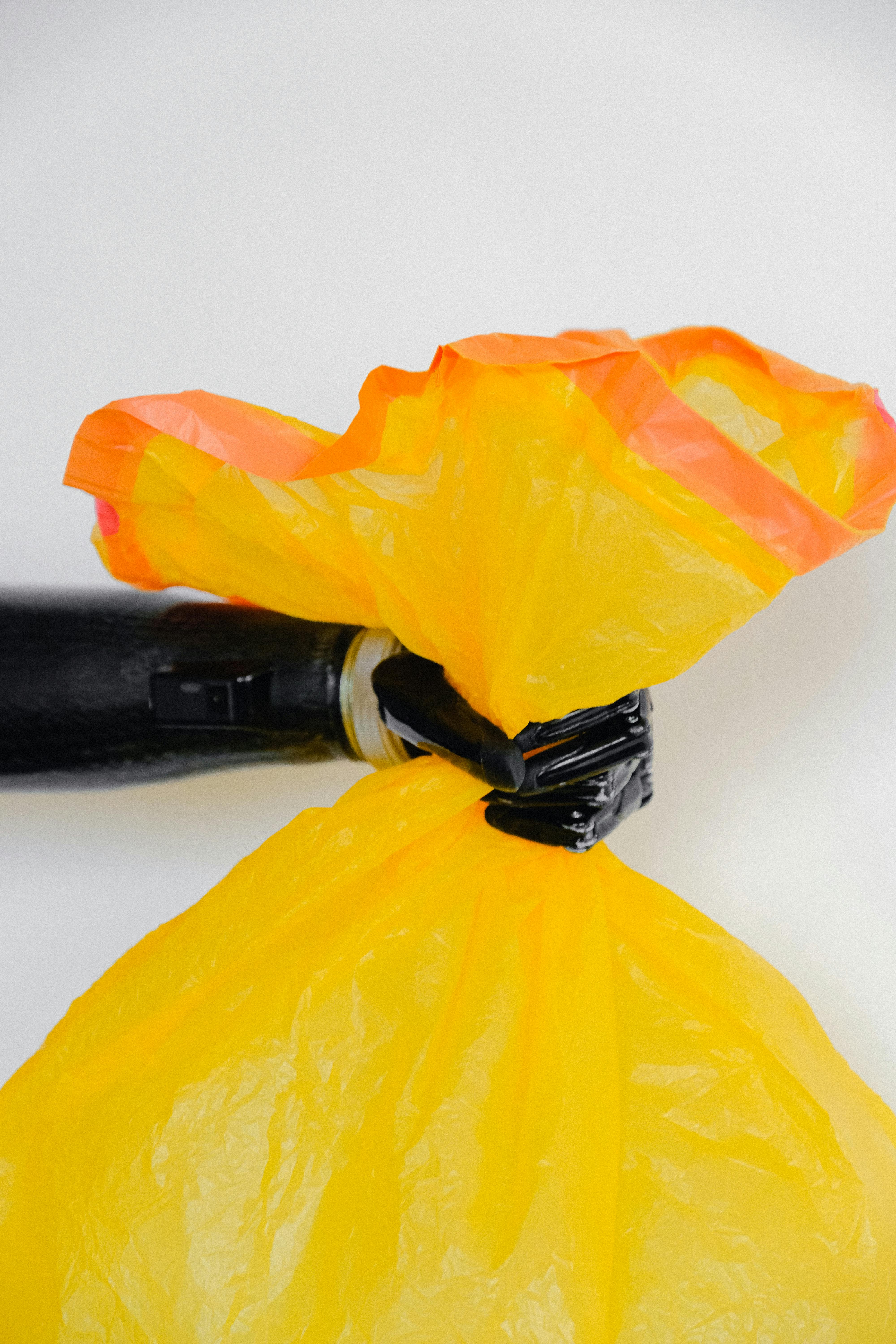 A person holding a trash bag | Source: Pexels