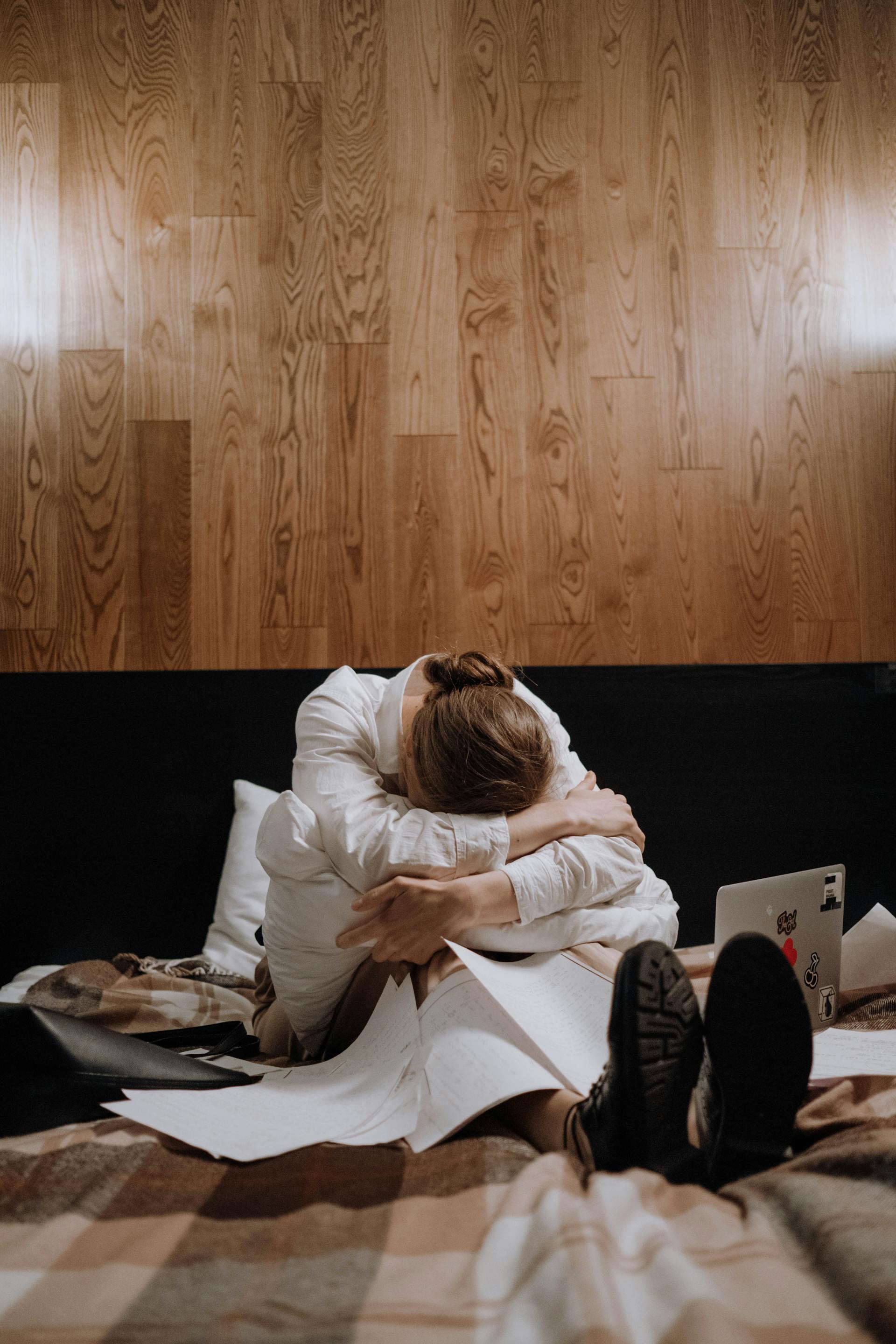 A tired woman sitting on the bed | Source: Pexels