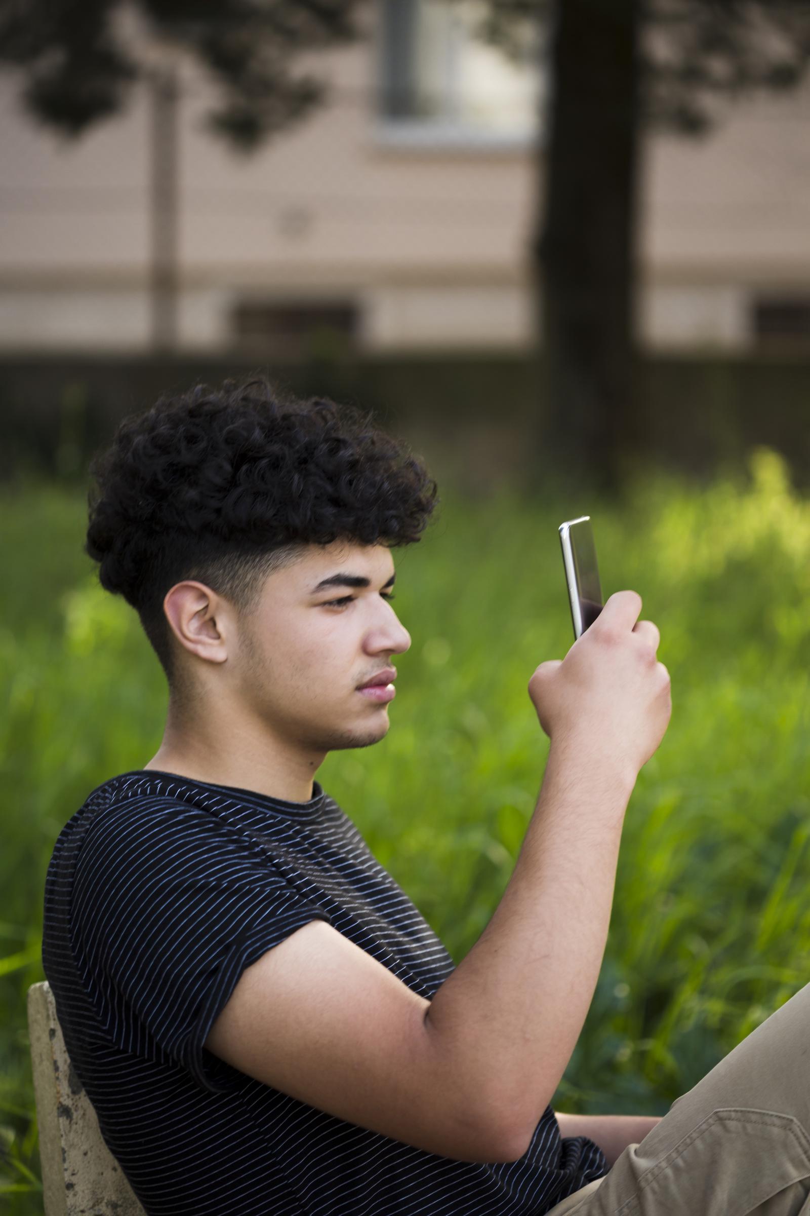 A boy recording from his phone | Source: Freepik