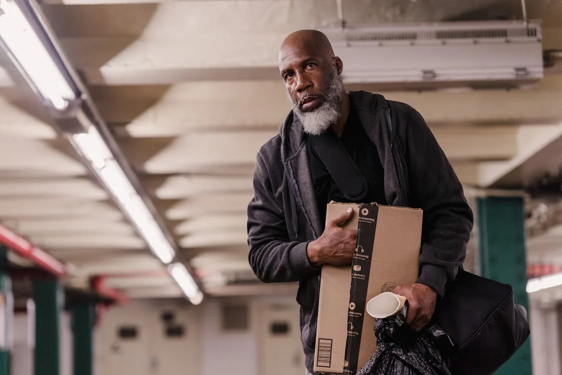 A homeless man walking | Source: Pexels