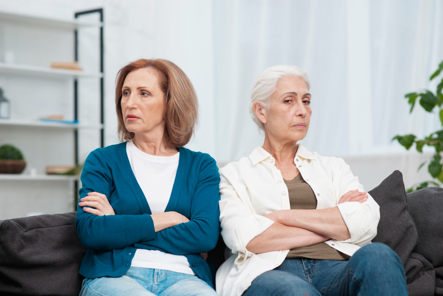 Two upset women sitting together | Source: Freepik