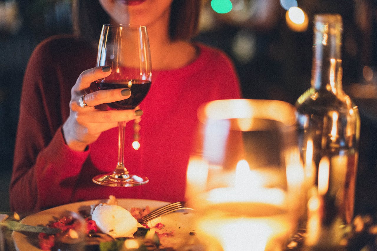 A woman holding a glass of wine | Source: Pexels