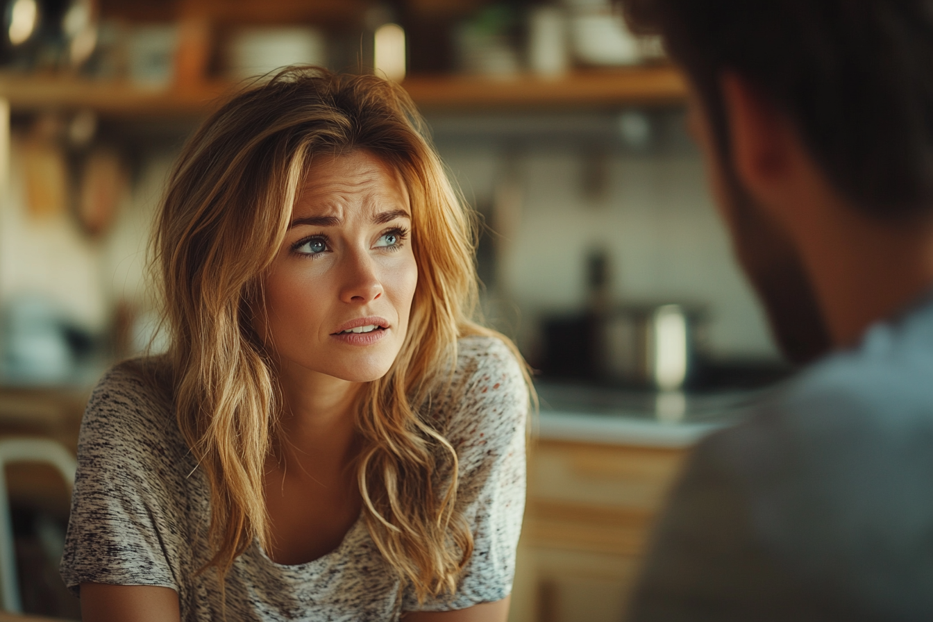 Shocked woman talking to her husband | Source: Midjourney