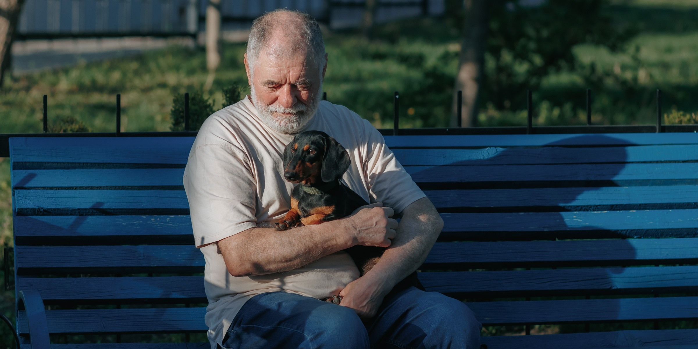 A man sitting with his dog | Source: Shutterstock