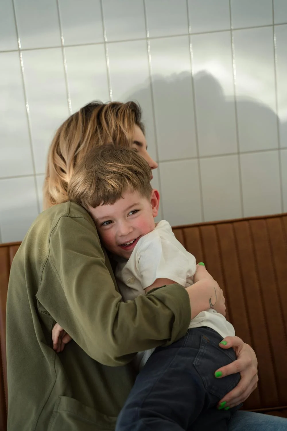 A woman hugging her son | Source: Pexels