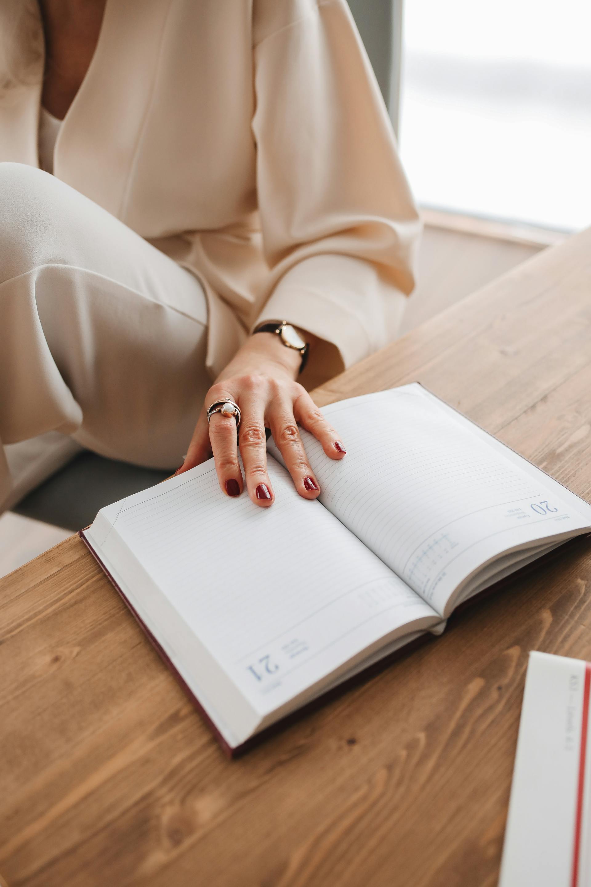 A woman checking her planner | Source: Pexels