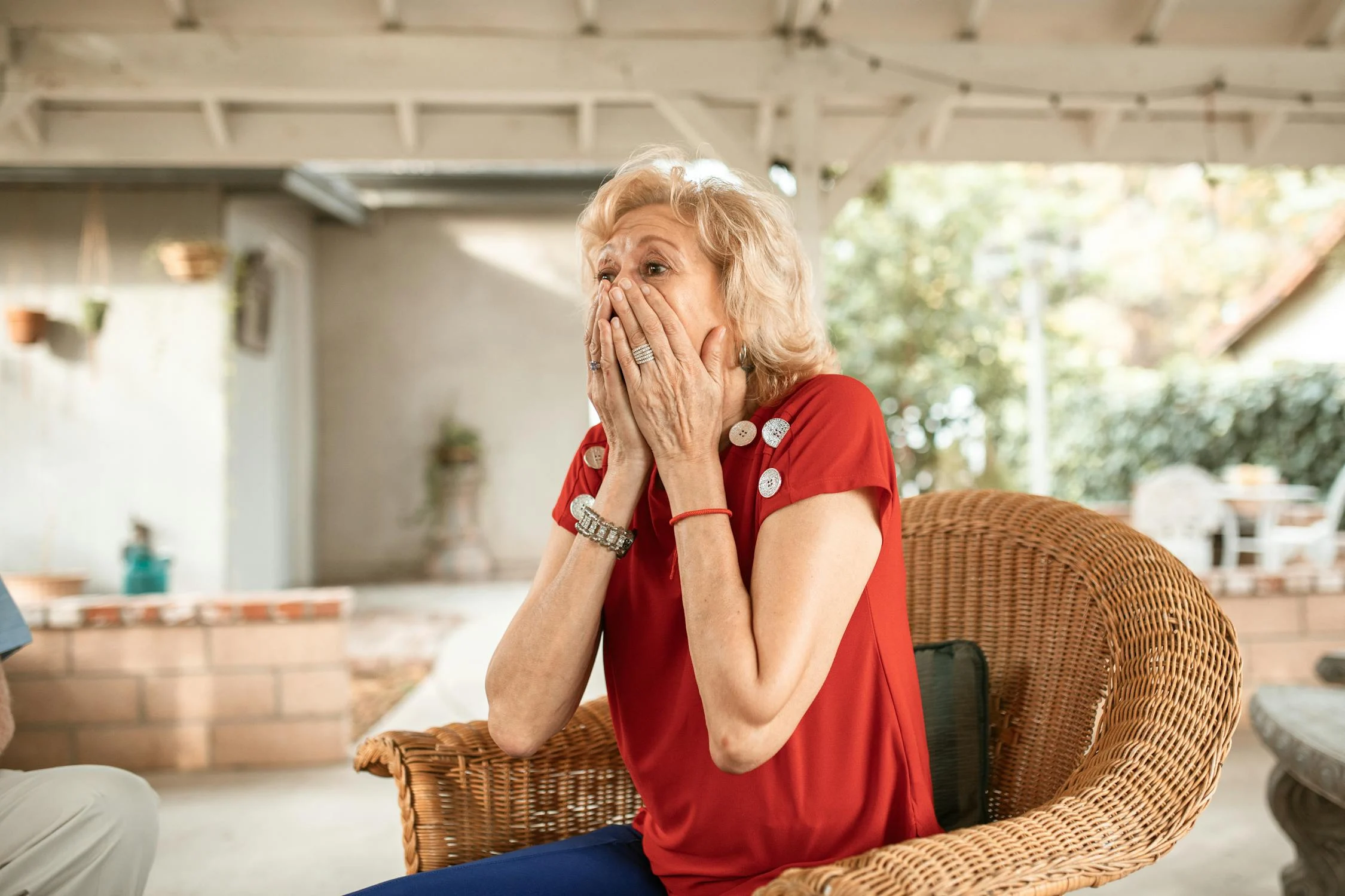 A shocked woman covering her face | Source: Pexels