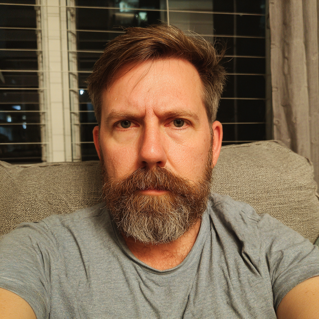 An annoyed man sitting on a couch | Source: Midjourney