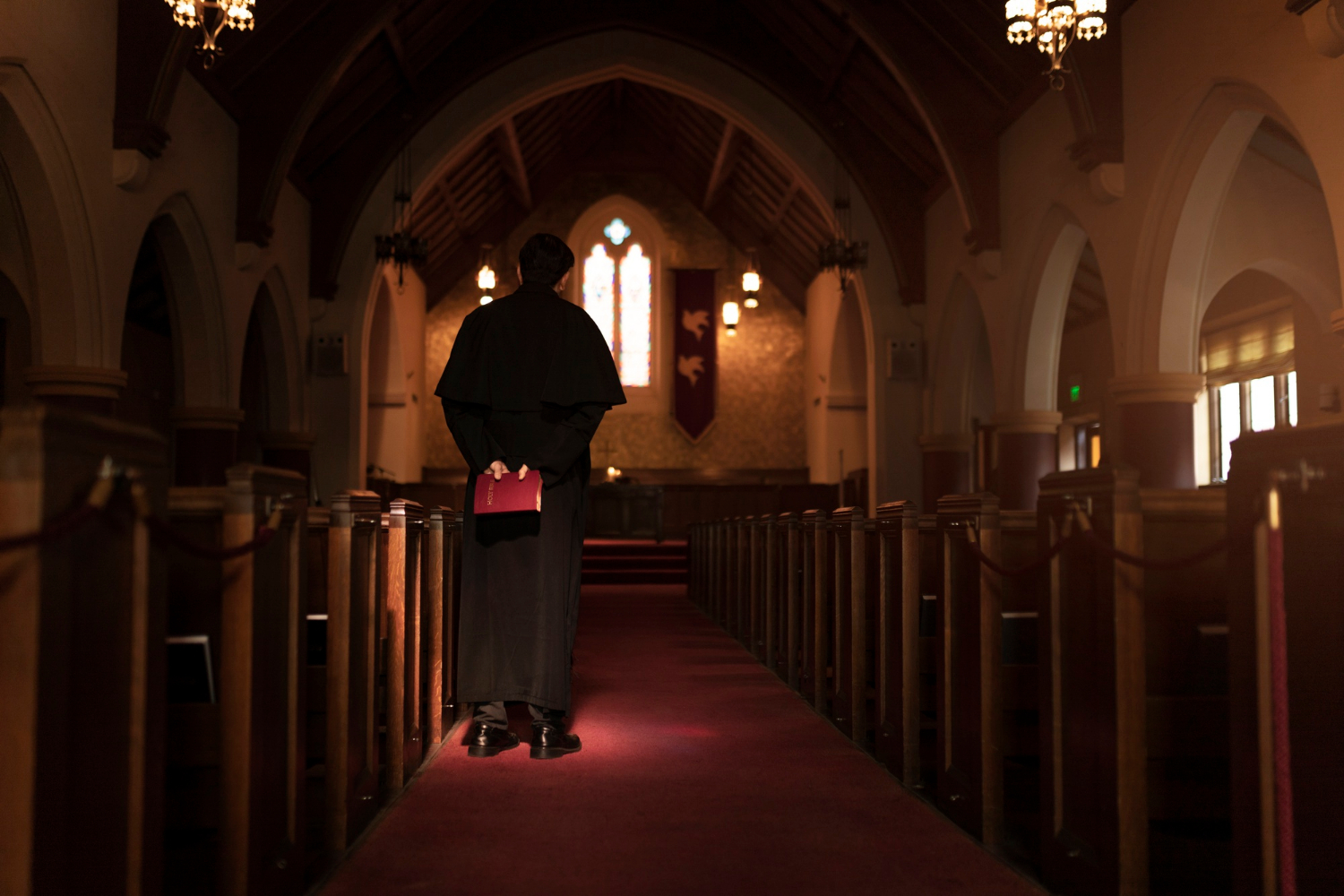 A priest inside a church | Source: Freepik