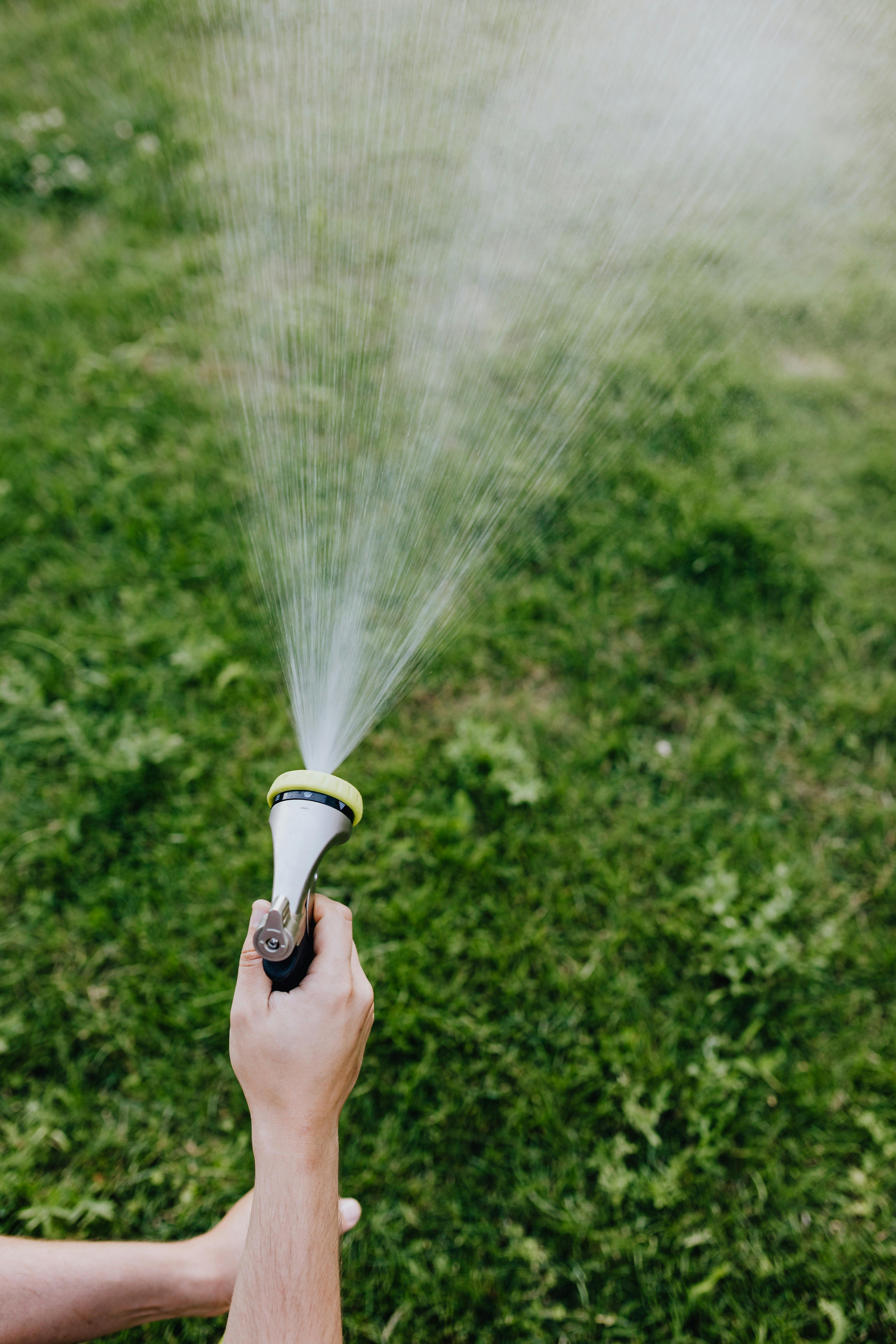 Someone using a hose | Source: Pexels
