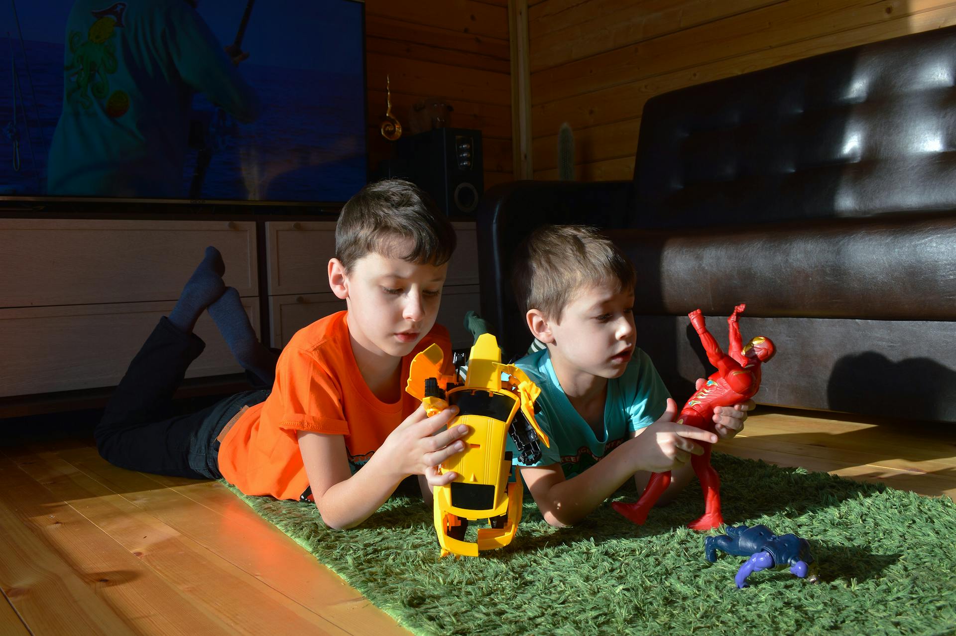 Two brothers playing with toys | Source: Pexels