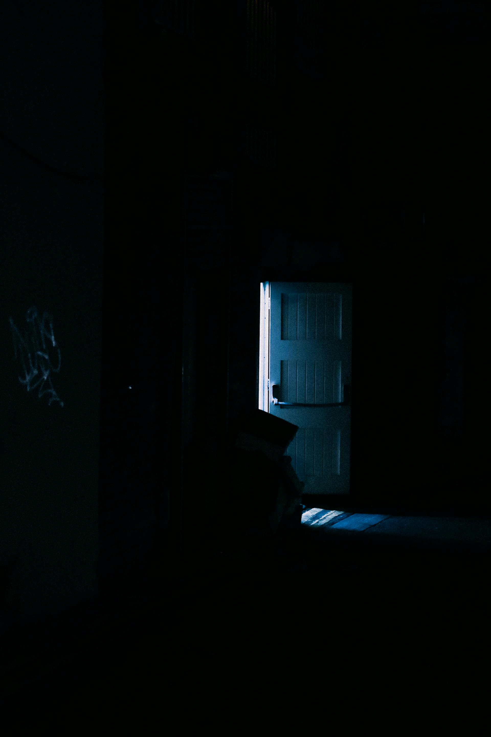 A door in a darkened area | Source: Pexels