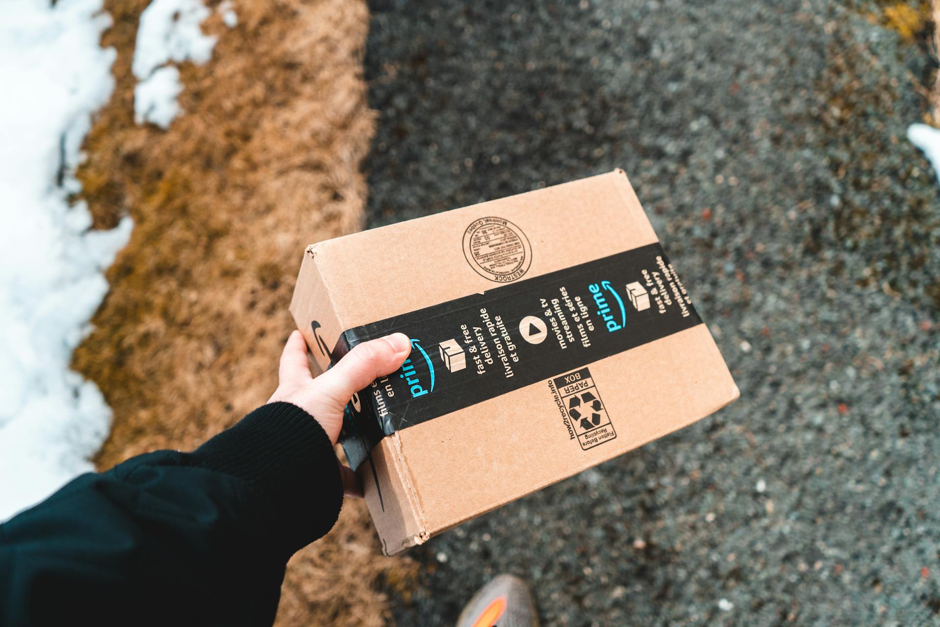 My Dad Invited My Brother and Me to His Wedding to the Woman He Cheated on Our Mom With – He Had No Idea He'd Regret It Soon 14 A person holding an Amazon parcel | Source: Pexels