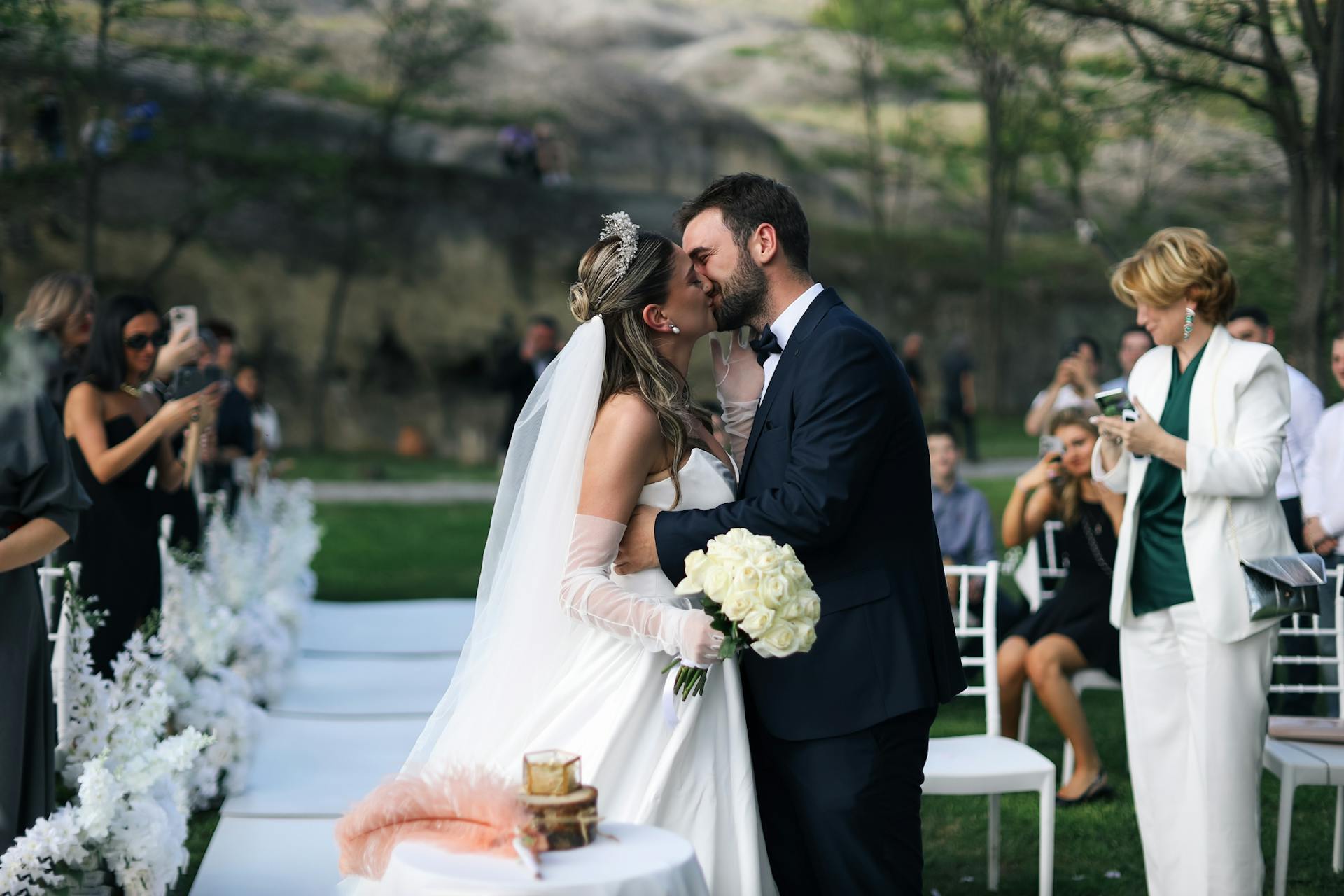 A newlywed couple sealing their vows with a kiss | Source: Pexels