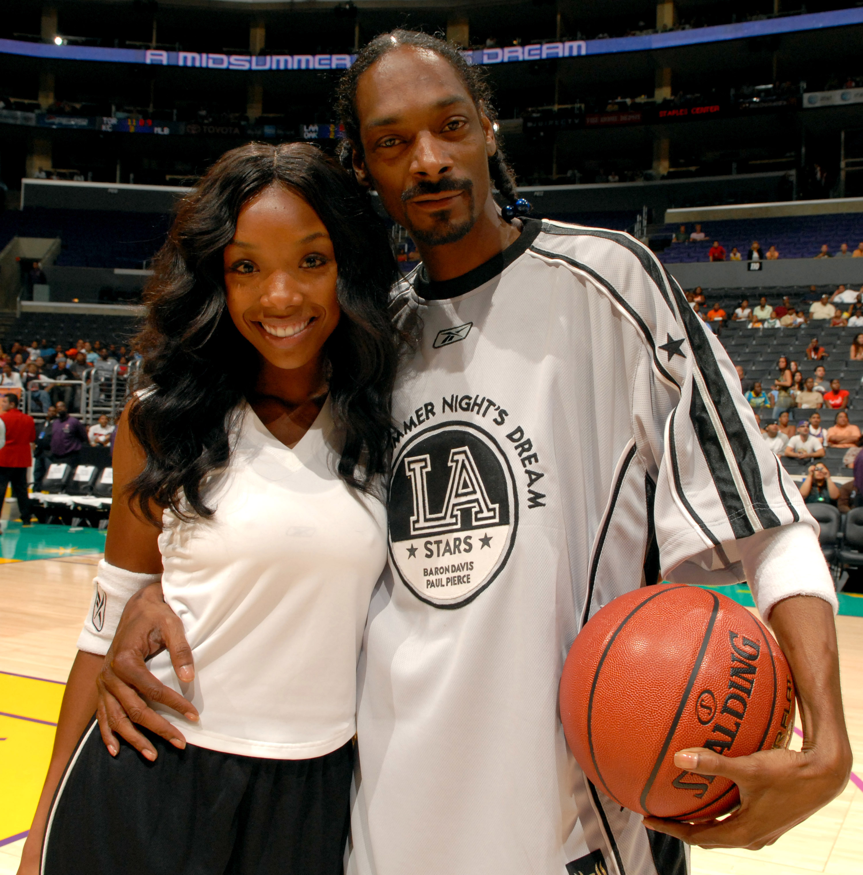Brandy and Snoop Dogg pose before A Midsummer Night's Dream Celebrity and All-Star Basketball Game on July 9, 2006 at the Staples Center in Los Angeles, California. | Source: Getty Images