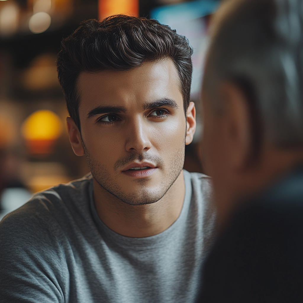 A young man telling his story to his new friend | Source: Midjourney