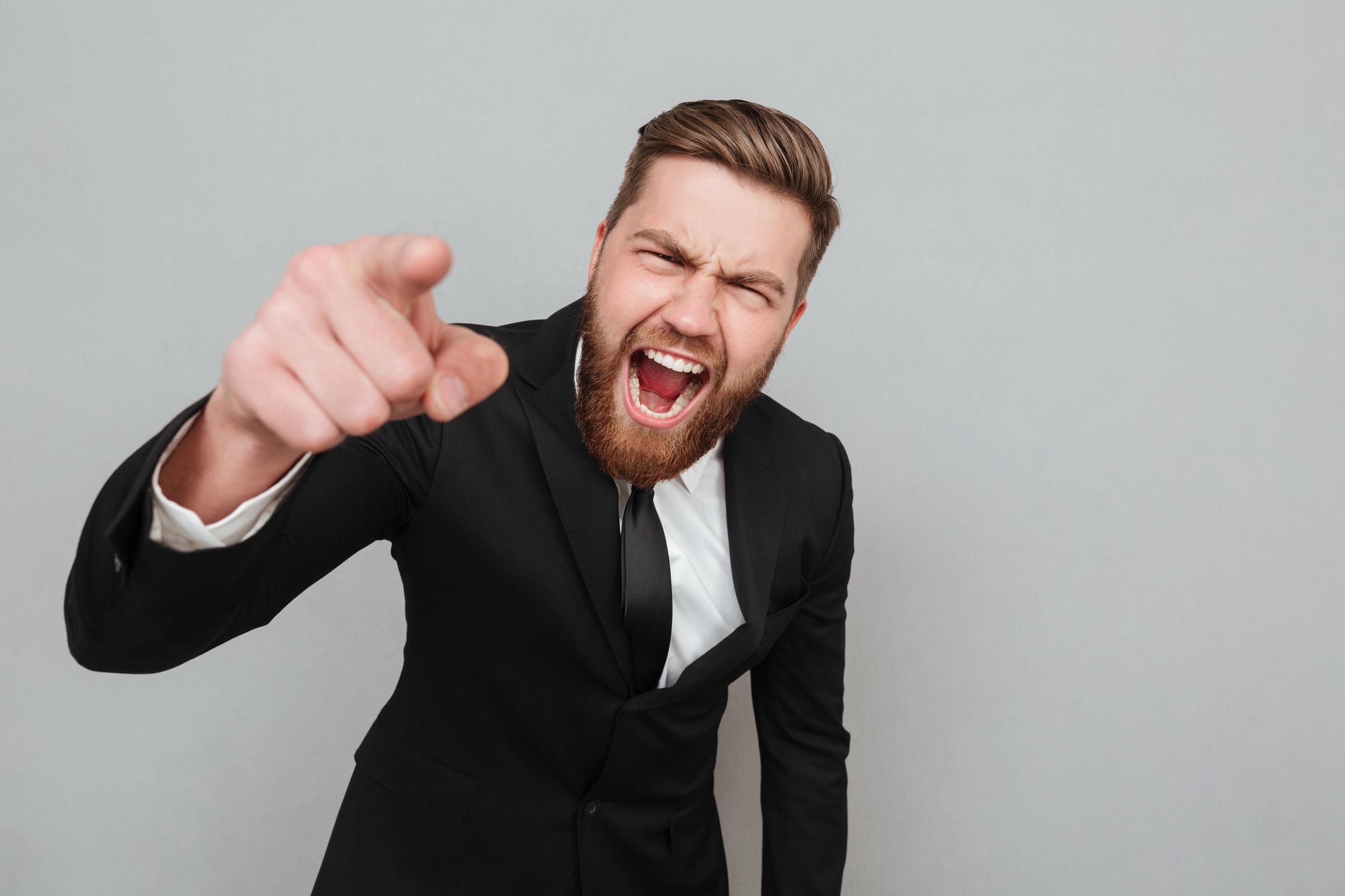 A man shouting and pointing | Source: Freepik