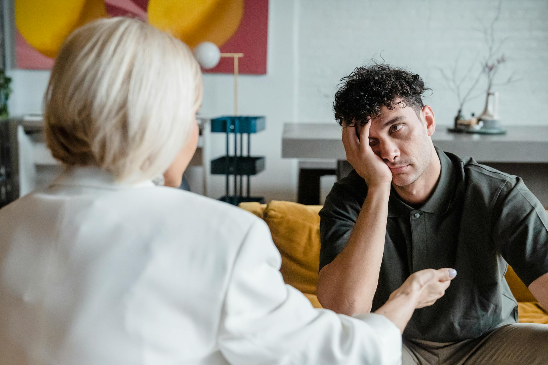 A frustrated man talking to an older woman | Source: Pexels