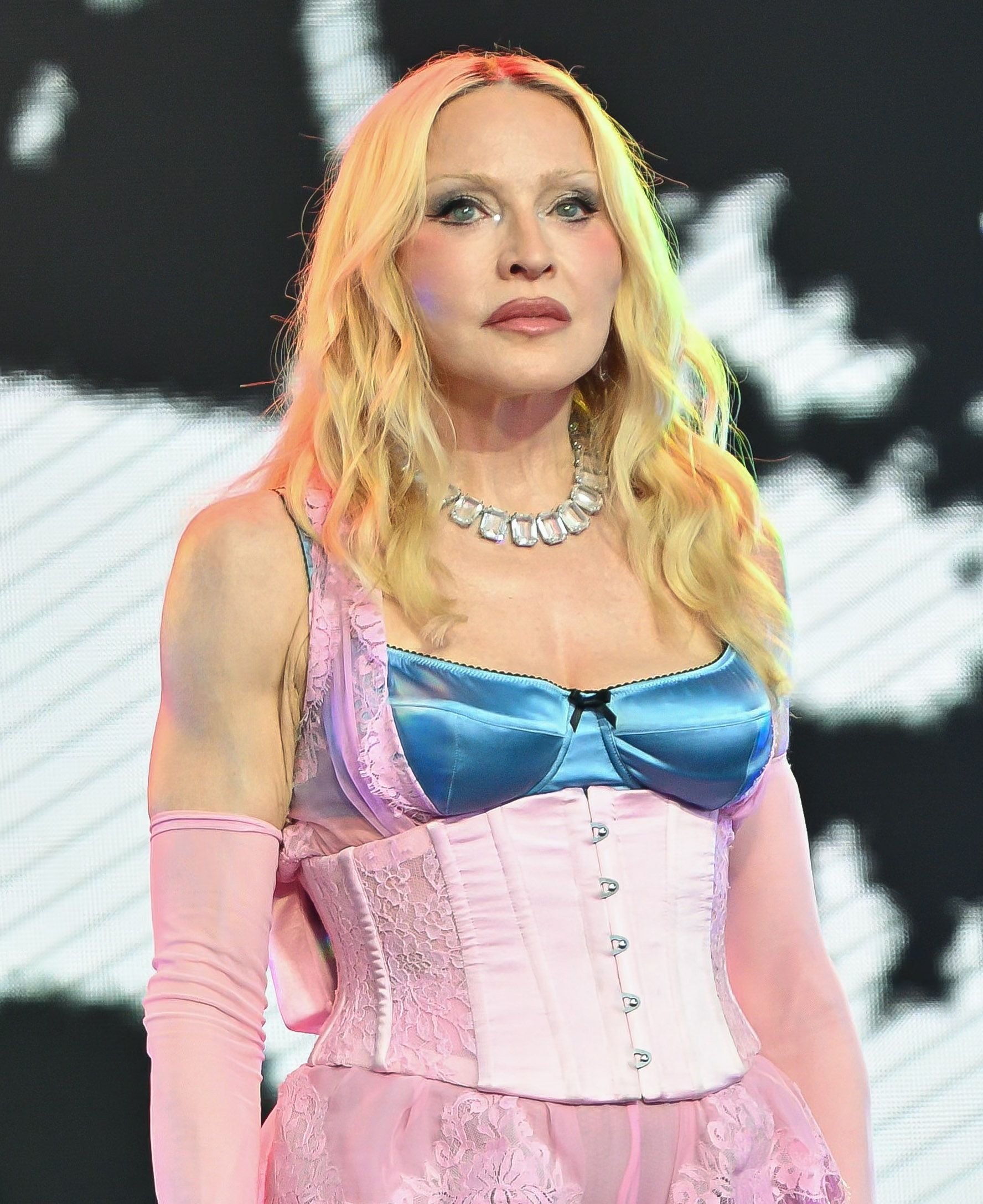 Madonna performs during a surprise concert in Times Square in New York City on June 4, 2026. The appearance came after a source said she wanted to look less sculpted, though Madonna has not confirmed making any specific change to her fillers. | Source: Getty Images
