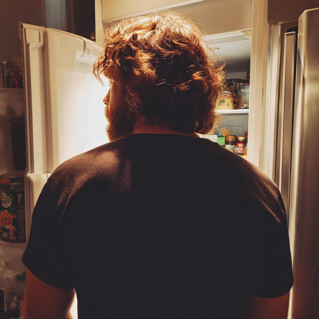 A man standing in a kitchen | Source: Midjourney