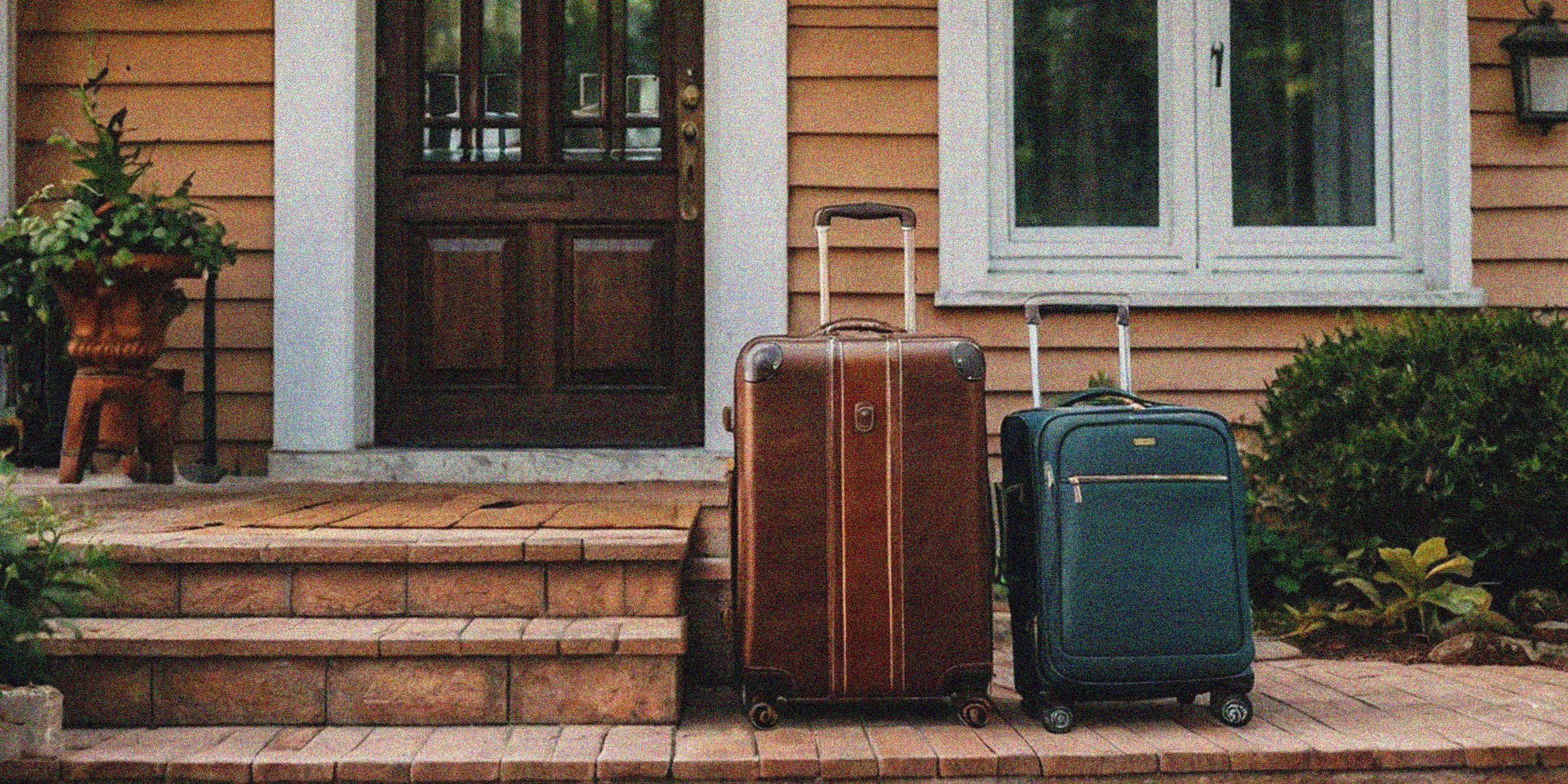 Two suitcases on a front porch | Source: Amomama