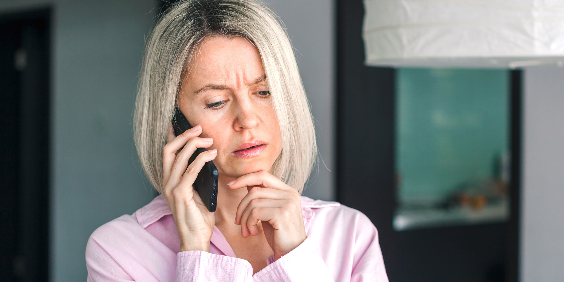 A woman talking on the phone | Source: Shutterstock