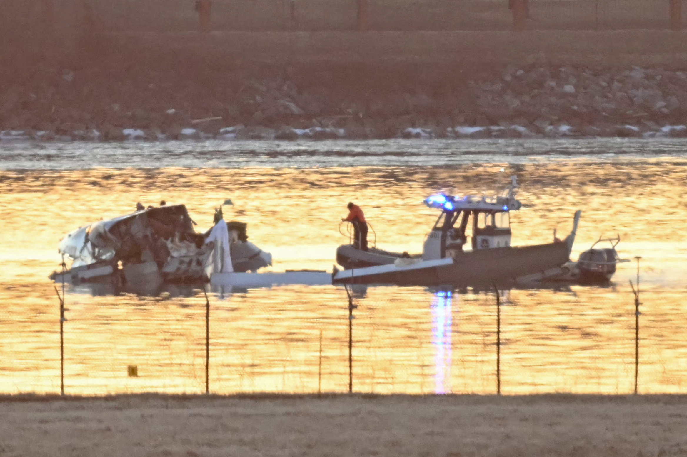 Rescuers search the Potomac River after a plane crash on January 30, 2025, near Washington, D.C. | Source: Getty Images