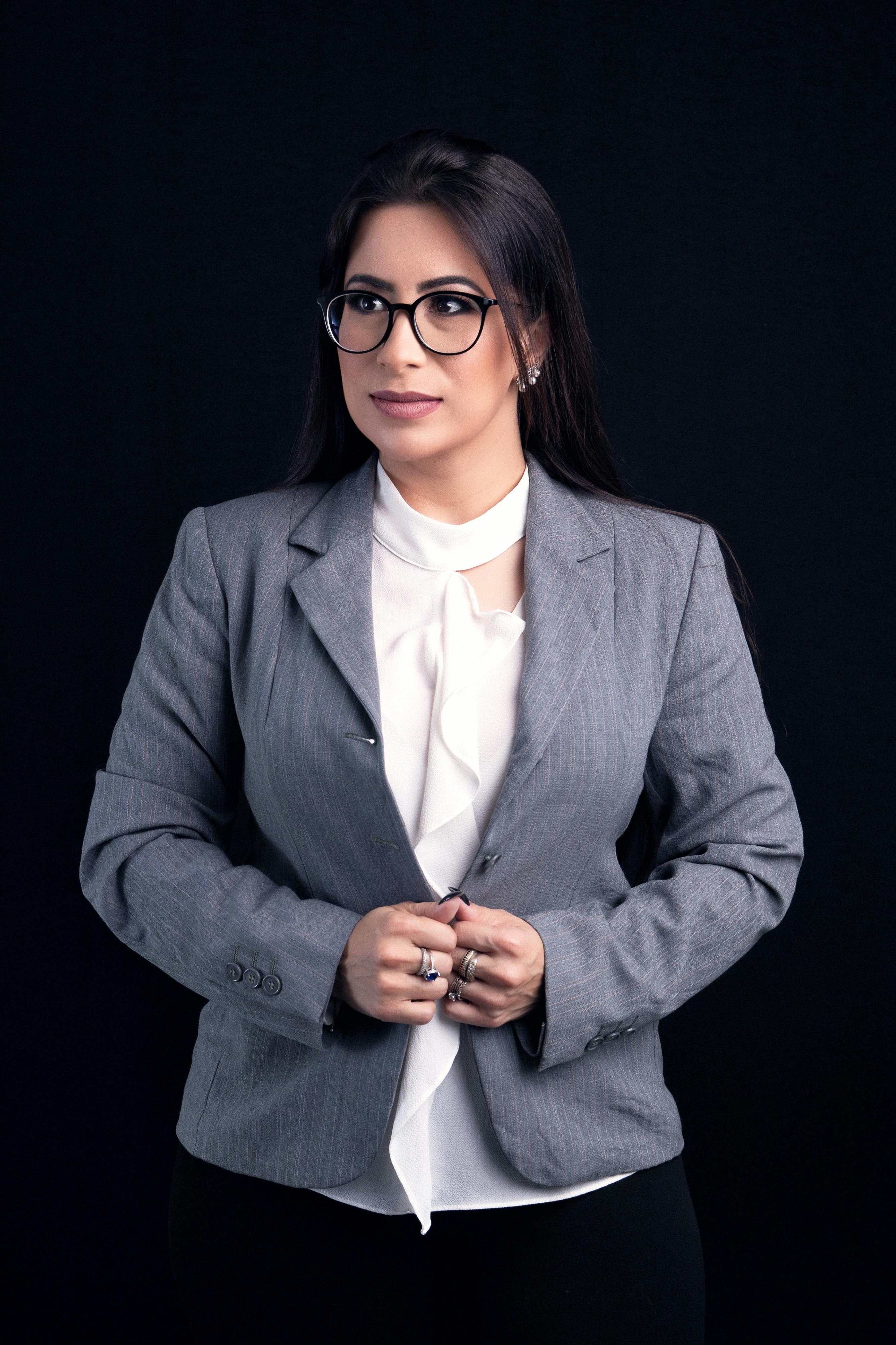 Surprised woman in a suit | Source: Pexels