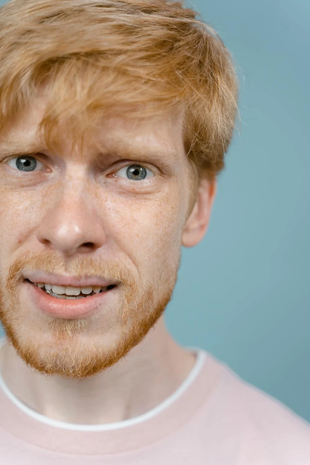 An unsure blue-eyed man looking at the camera | Source: Pexels