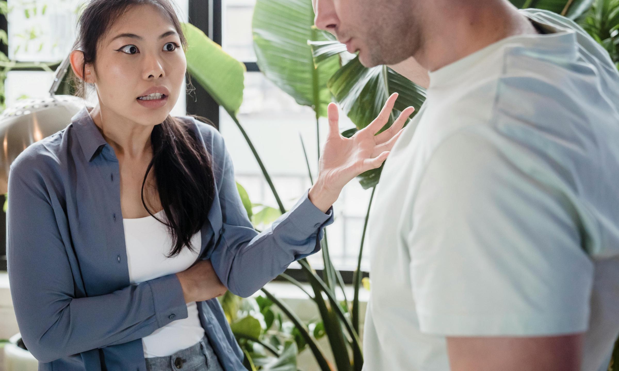 Rachel and James having a heated discussion in the living room | Source: Pexels