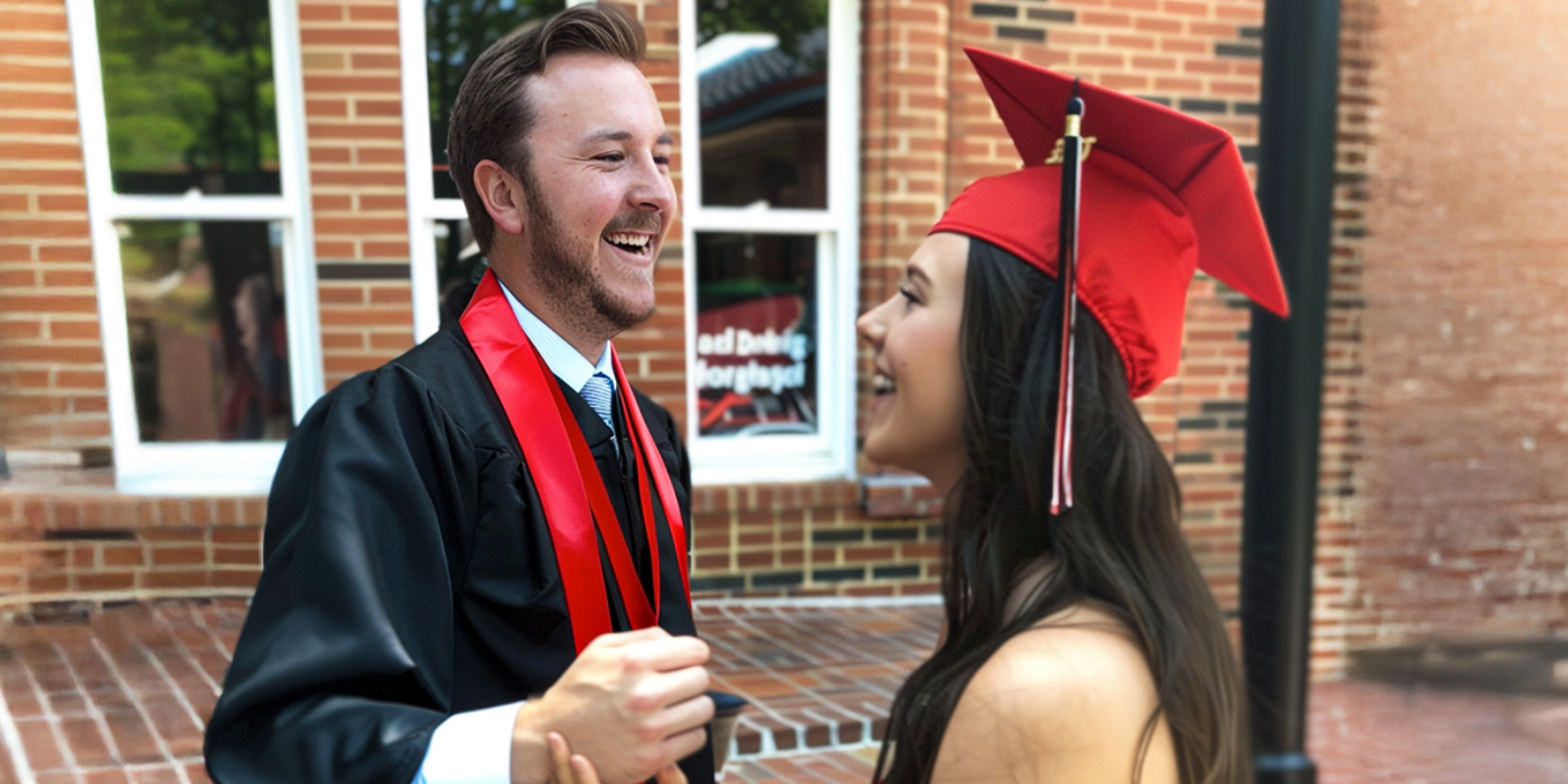 Two graduates laughing | Source: AmoMama