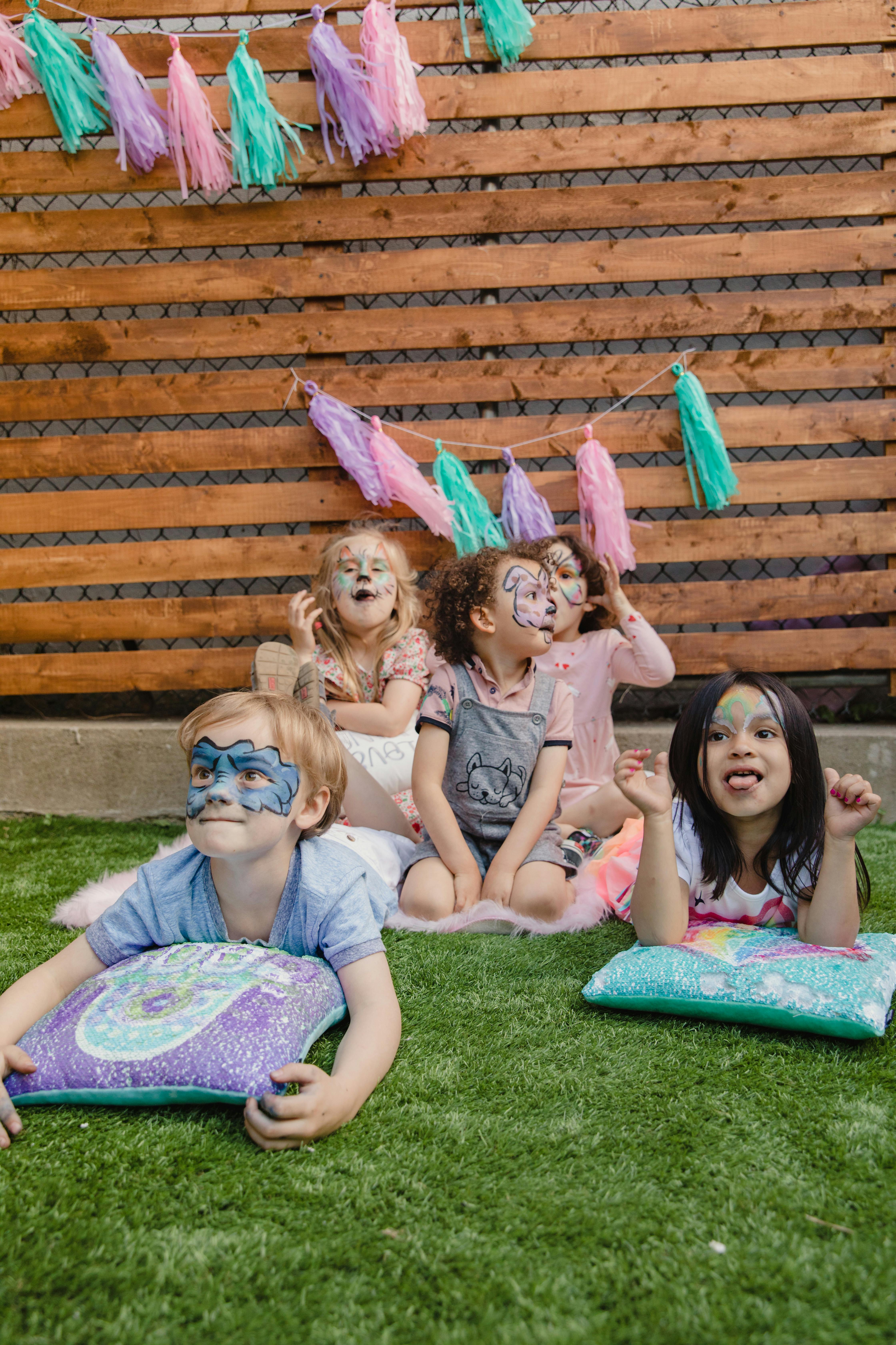 Children playing on the grass | Source: Pexels