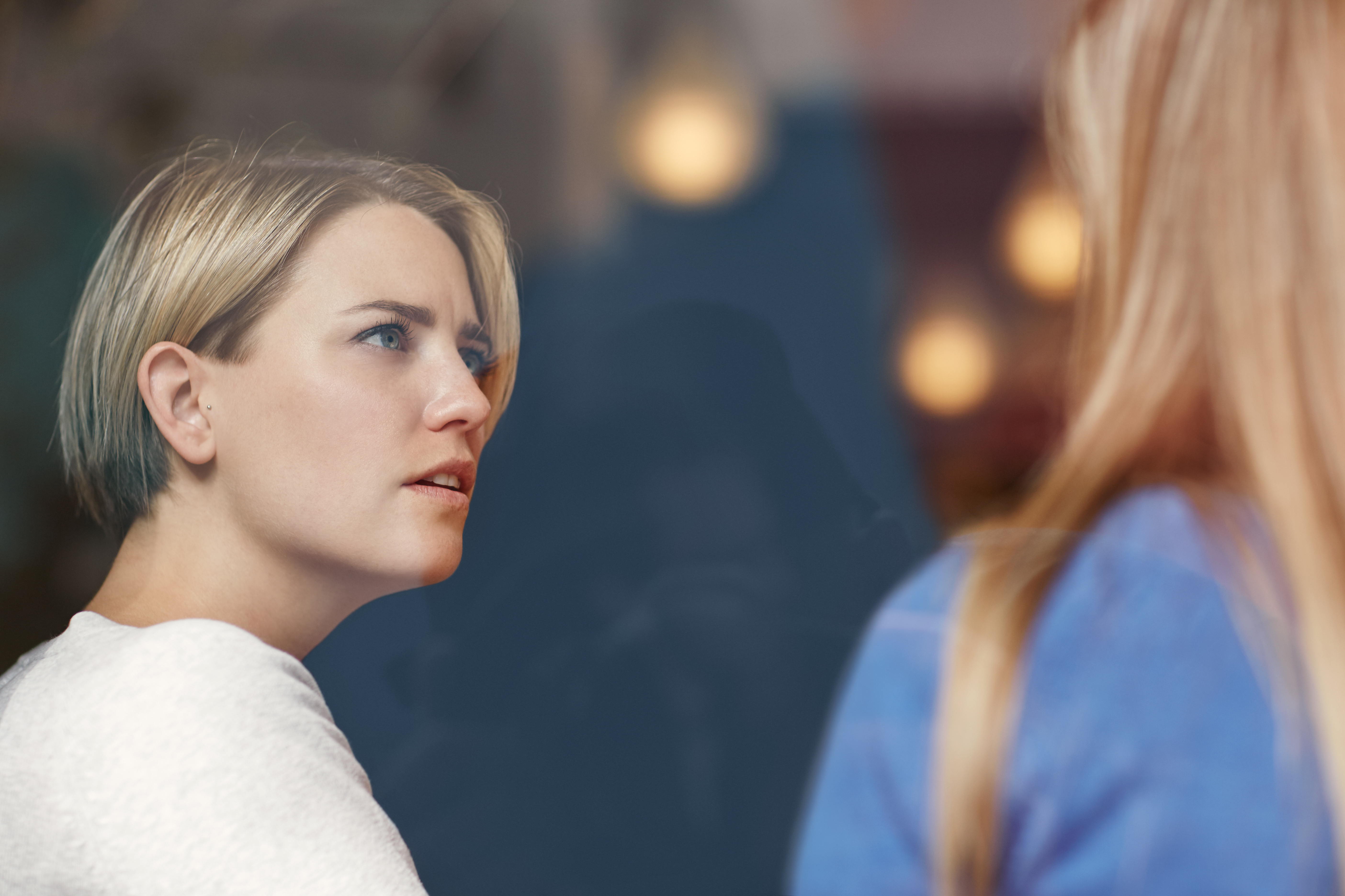 A woman talking to another woman | Source: Shutterstock