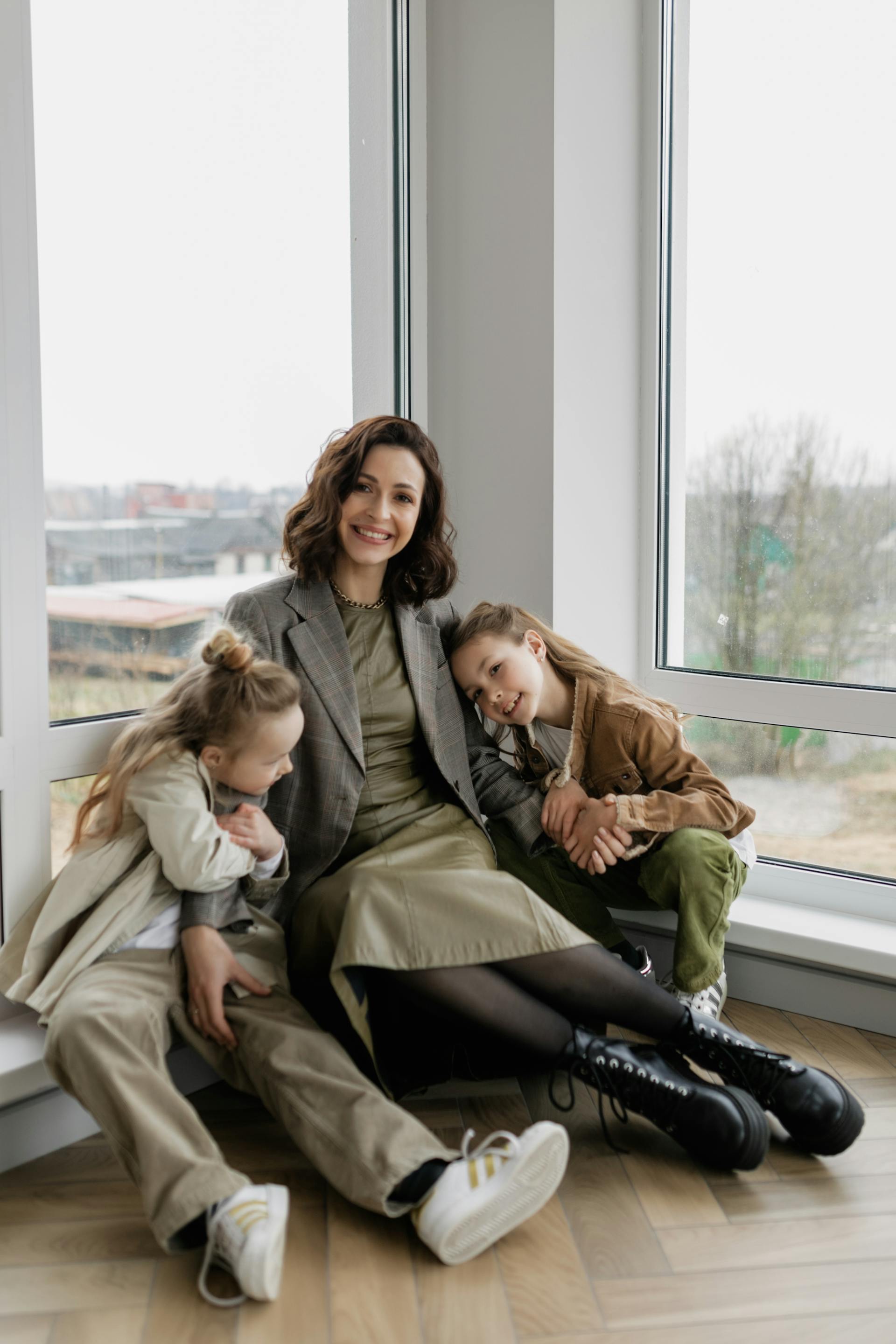 A mother with her little girls | Source: Pexels